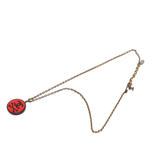 CC Gold Plated Resin Crossbones Round Pendant Necklace - Image 1