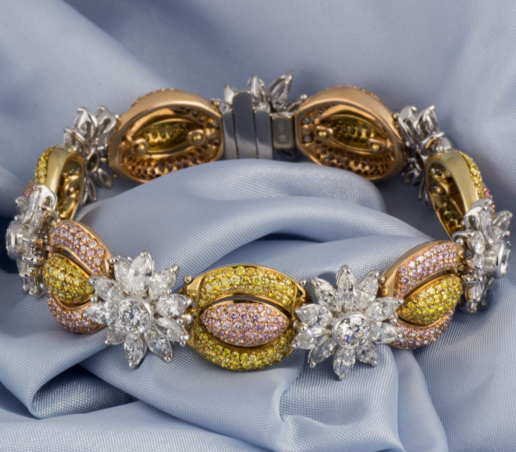 18ct white gold, white, yellow & pink fancy diamond bracelet