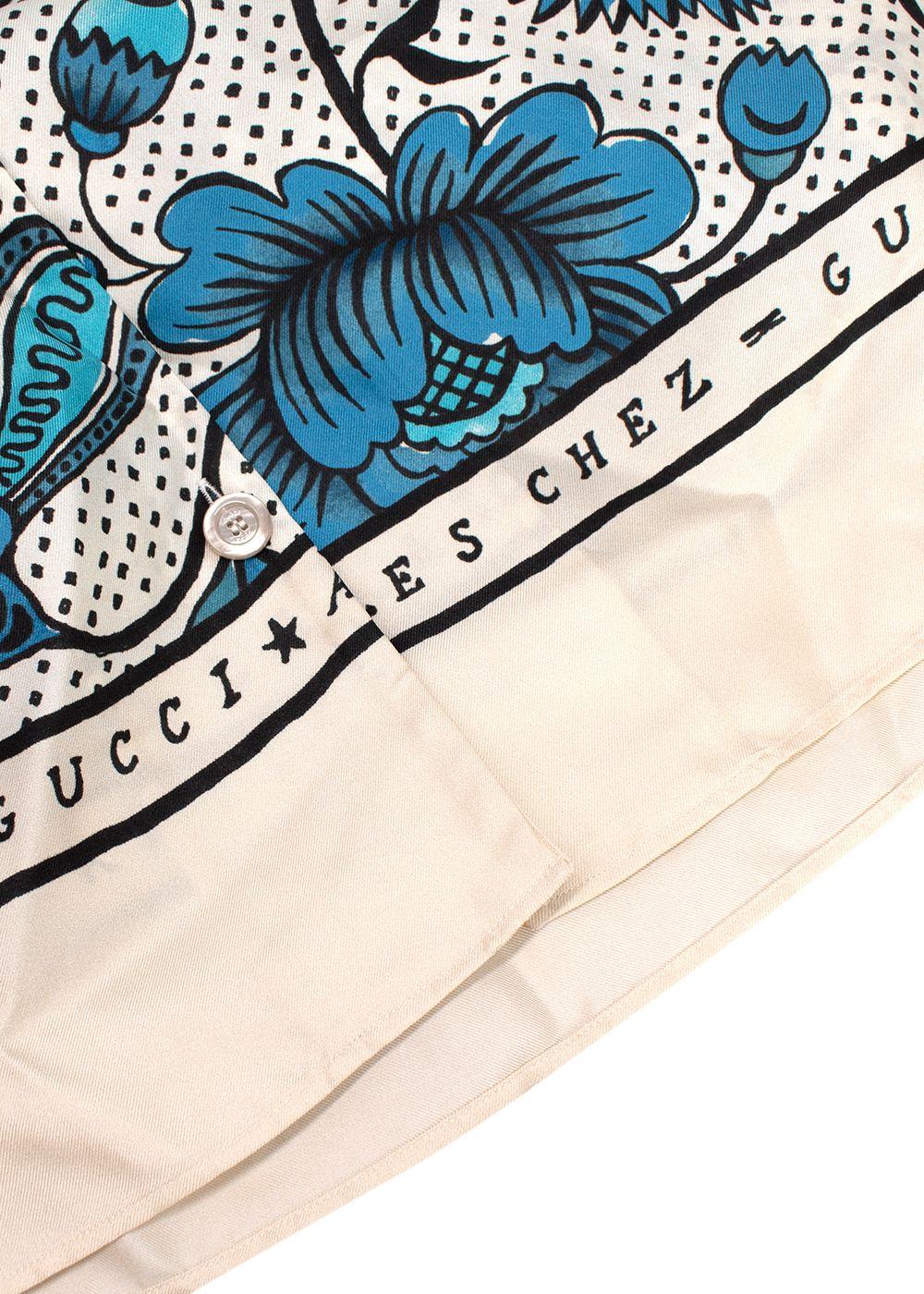 blue/white short sleeve shirt with floral print
