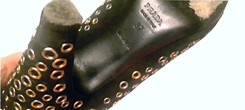 Prada Black and Gold Eyelet Pumps