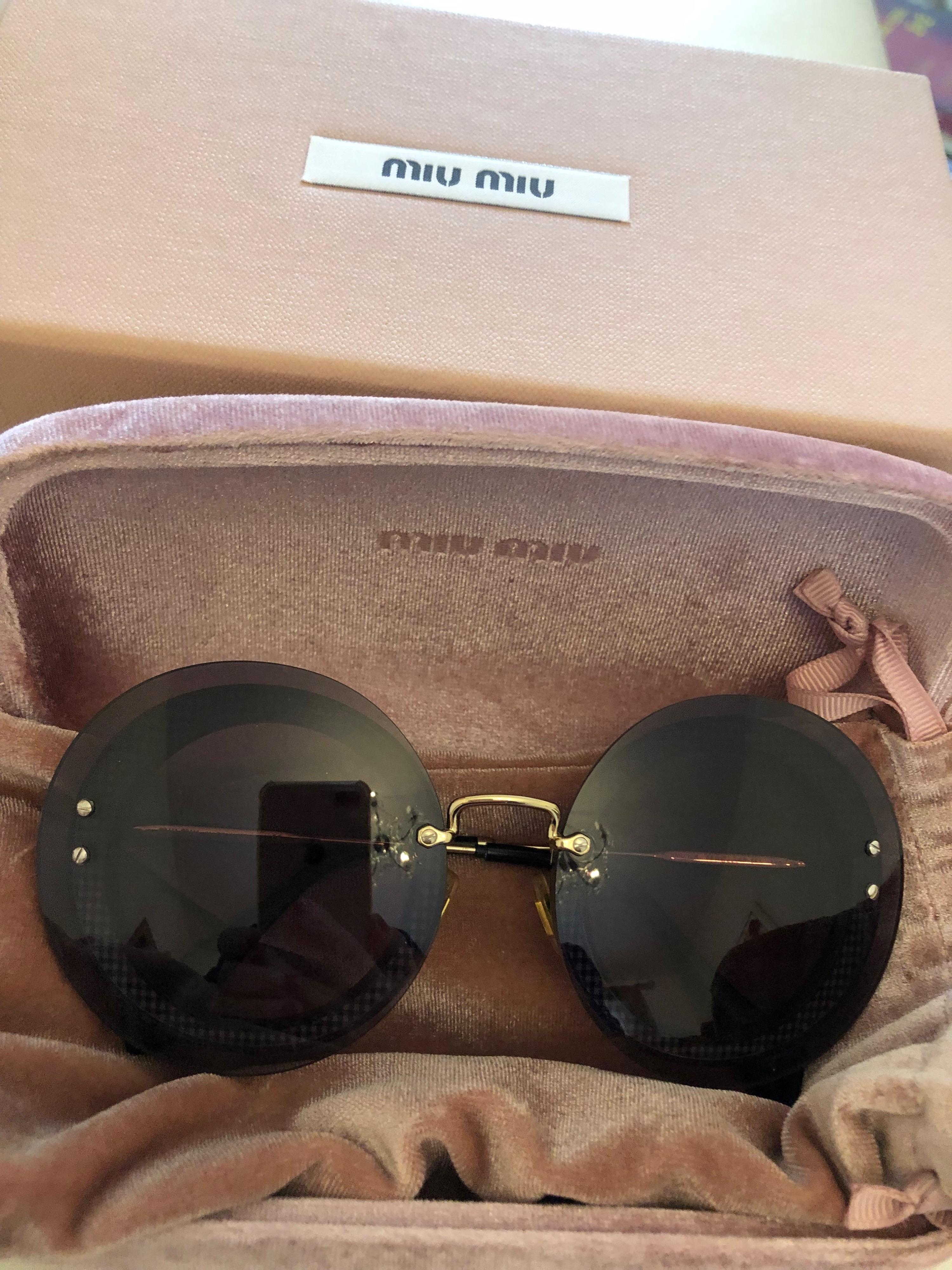 Miu Miu Black Round Sunglasses