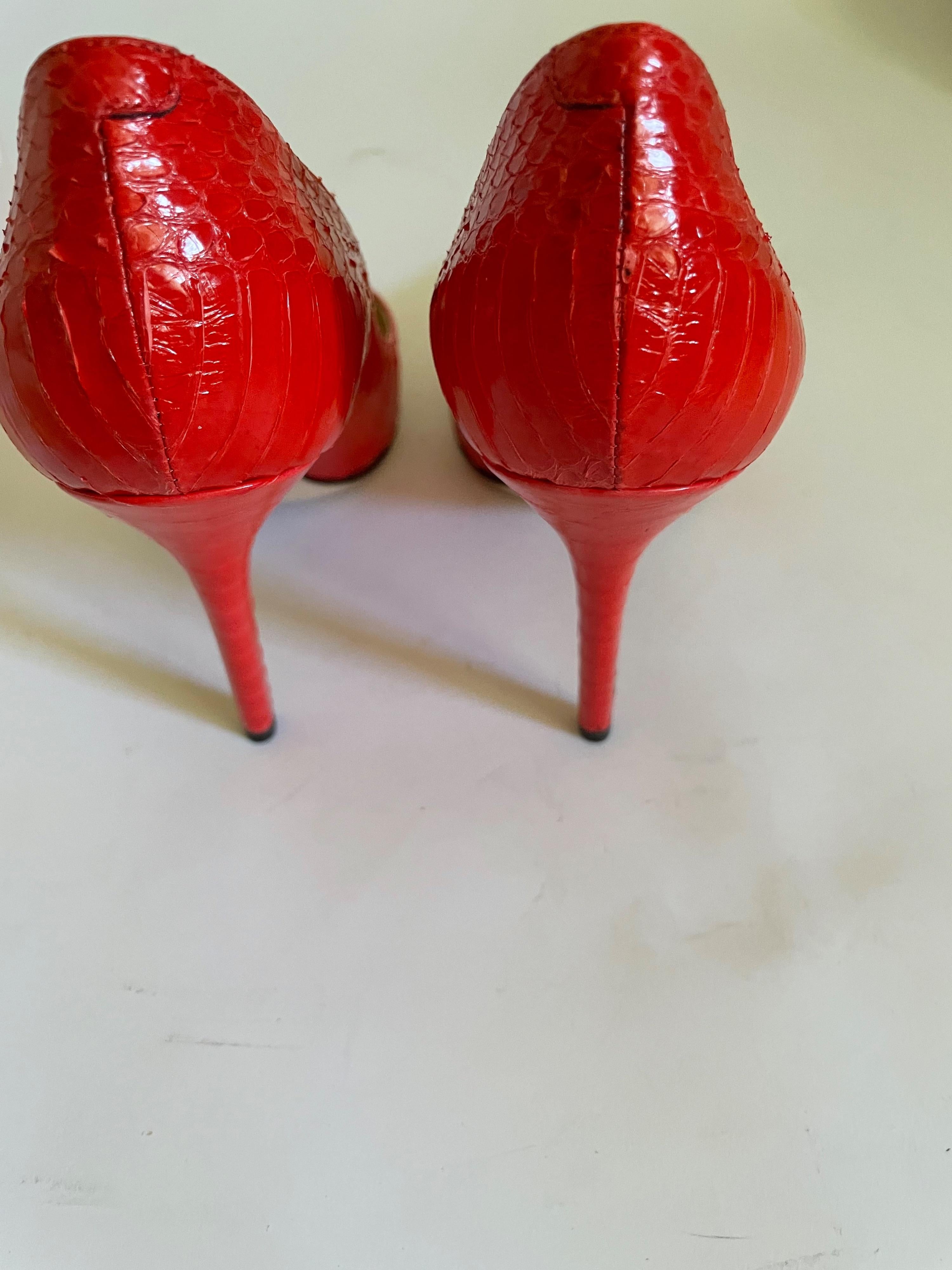 Red snakeskin Avril heeled pumps