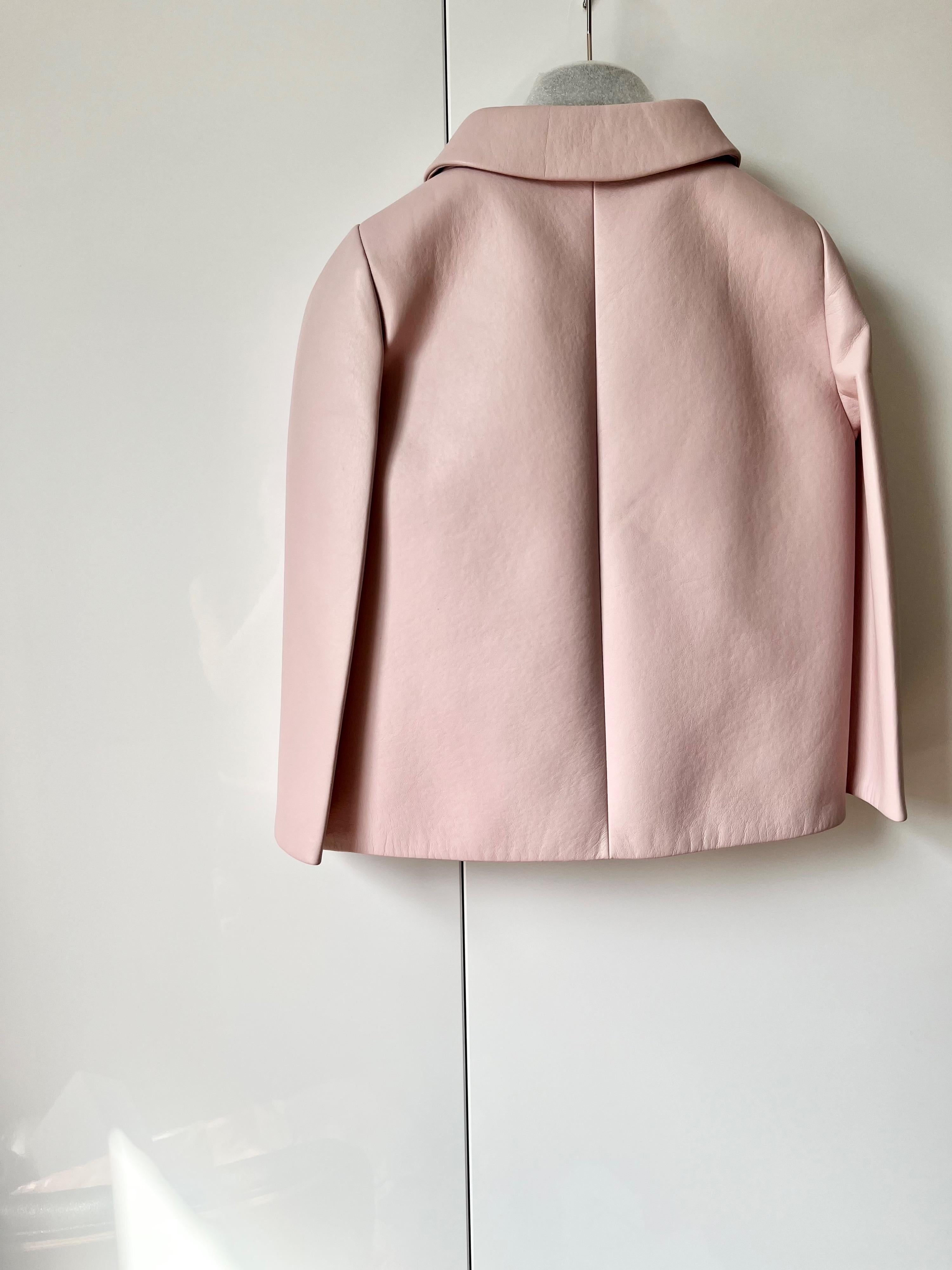 Pale pink cropped leather jacket