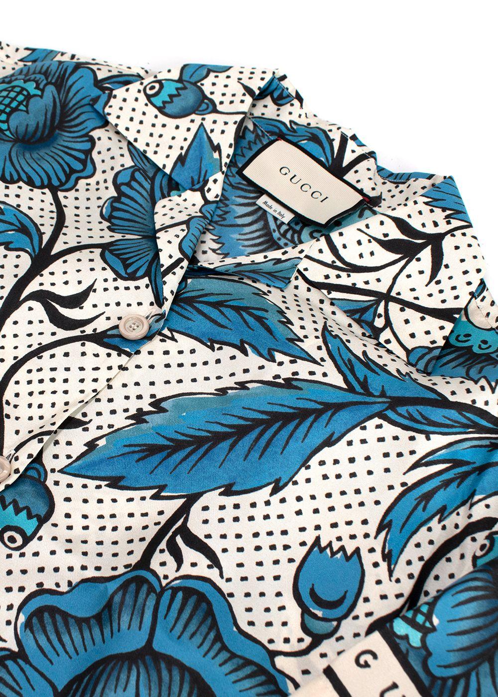 blue/white short sleeve shirt with floral print
