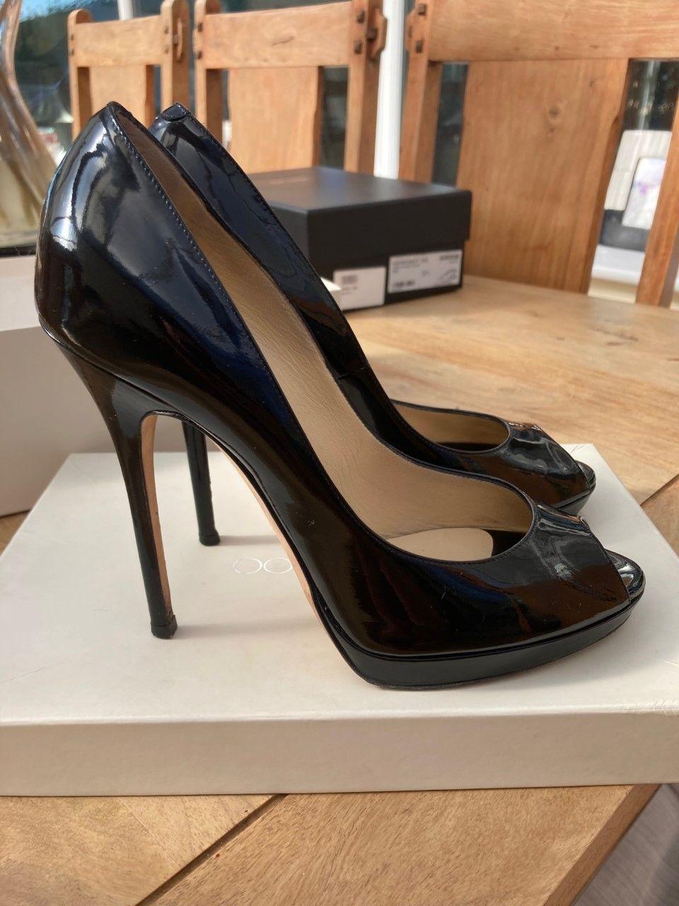Black patent peep-toe heeled pumps