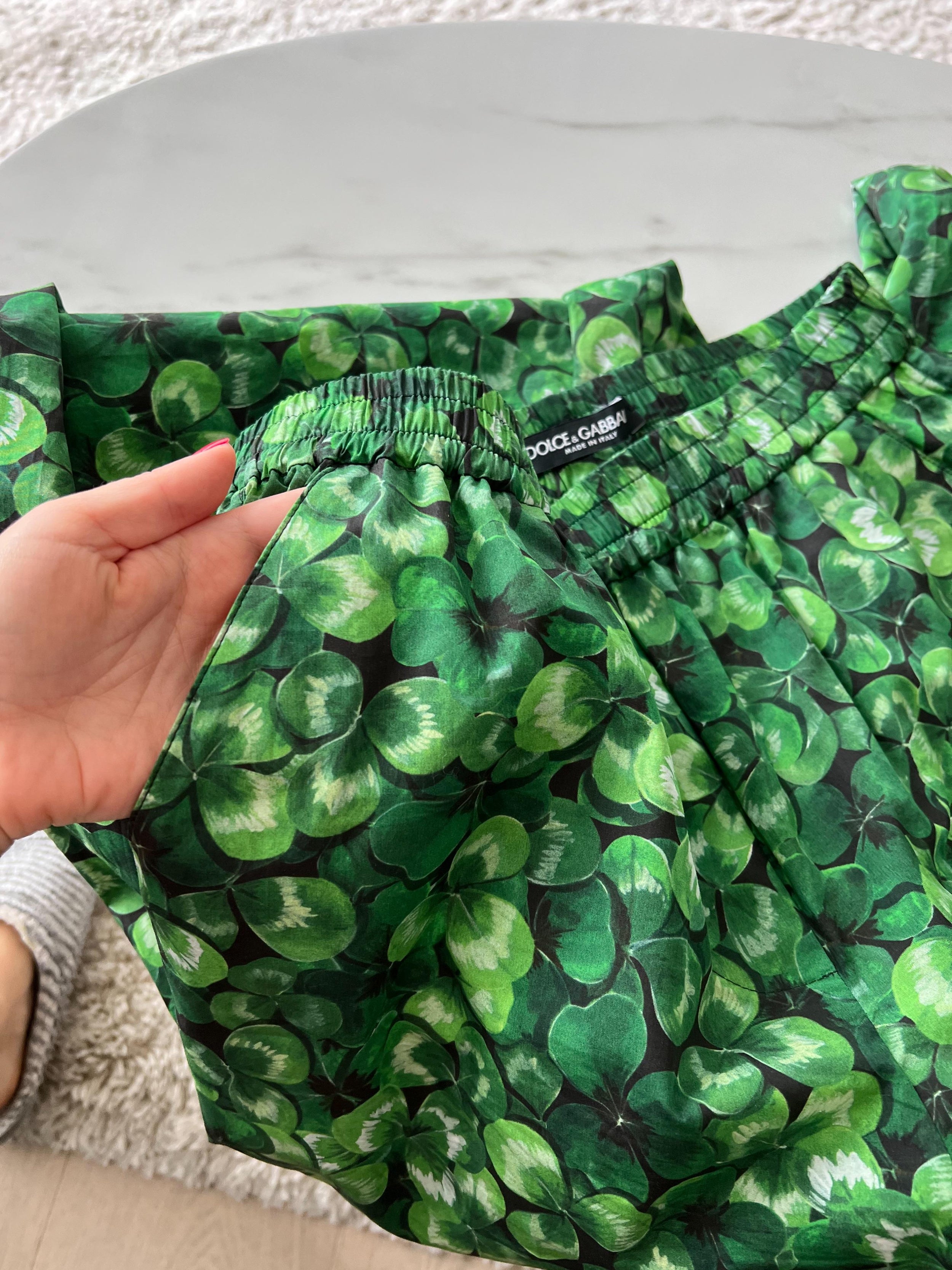Green clover print cotton trousers