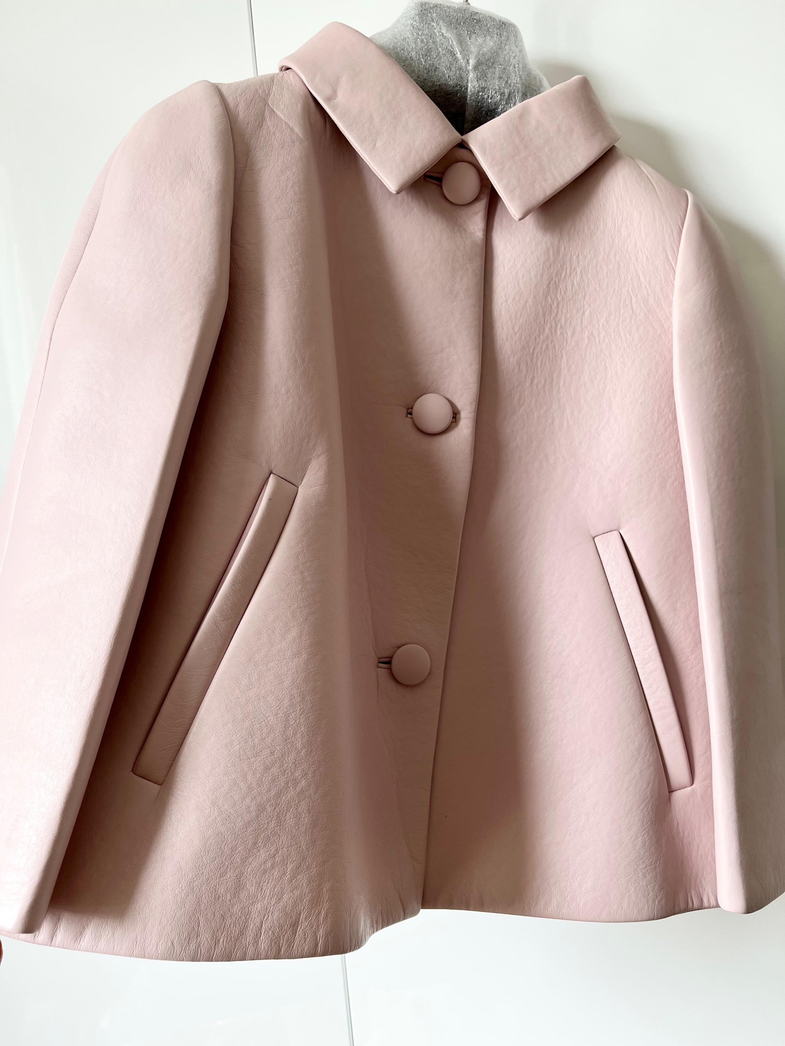 Pale pink cropped leather jacket