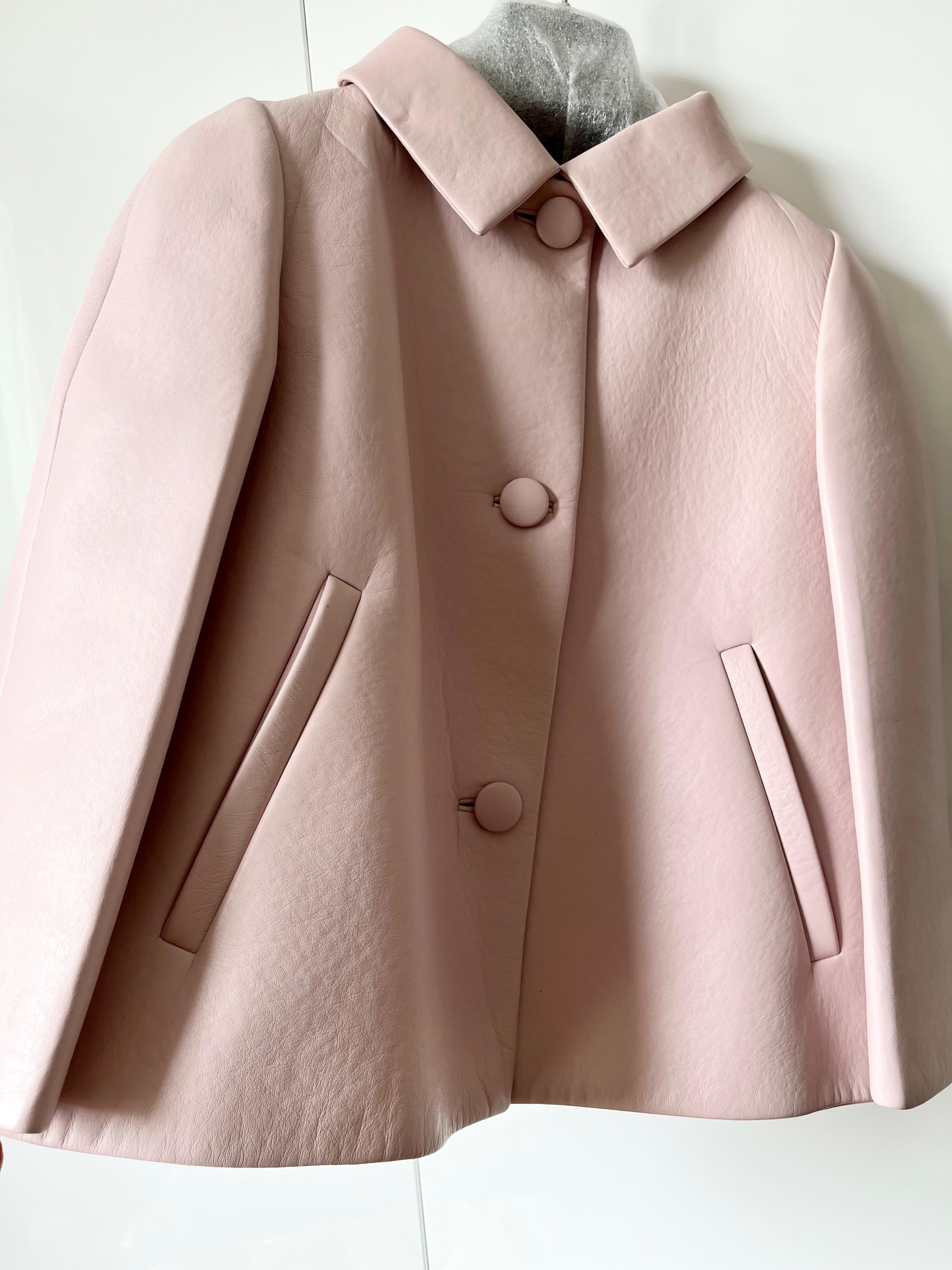 Pale pink cropped leather jacket