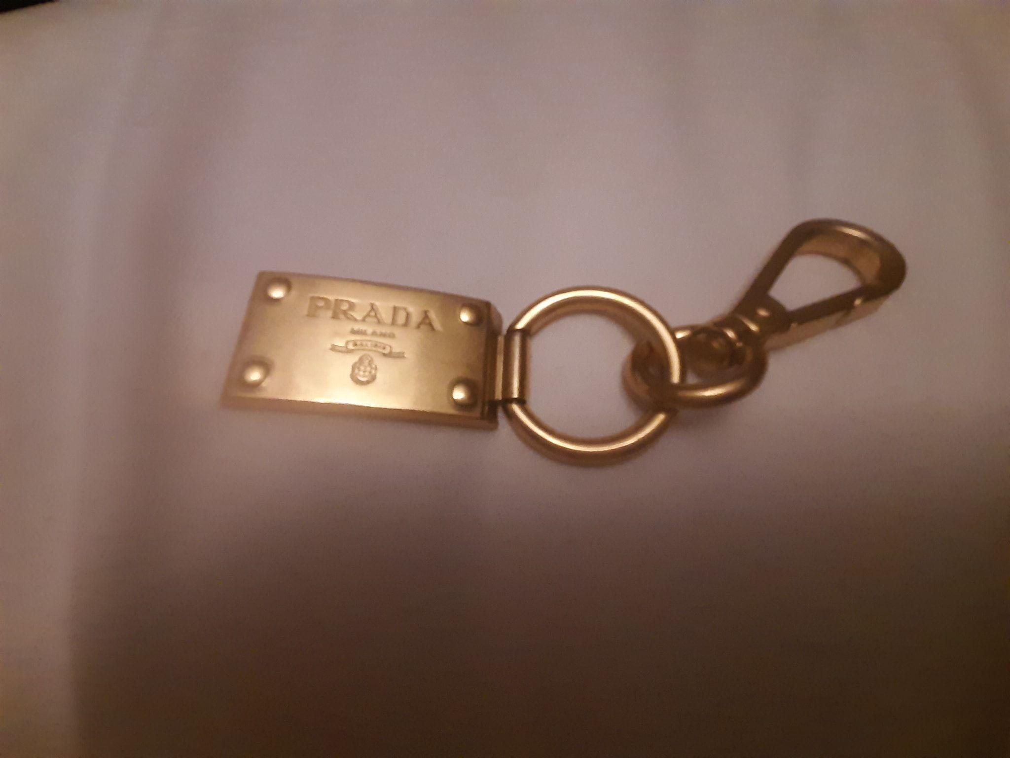 Gold-tone metal logo charm keyring