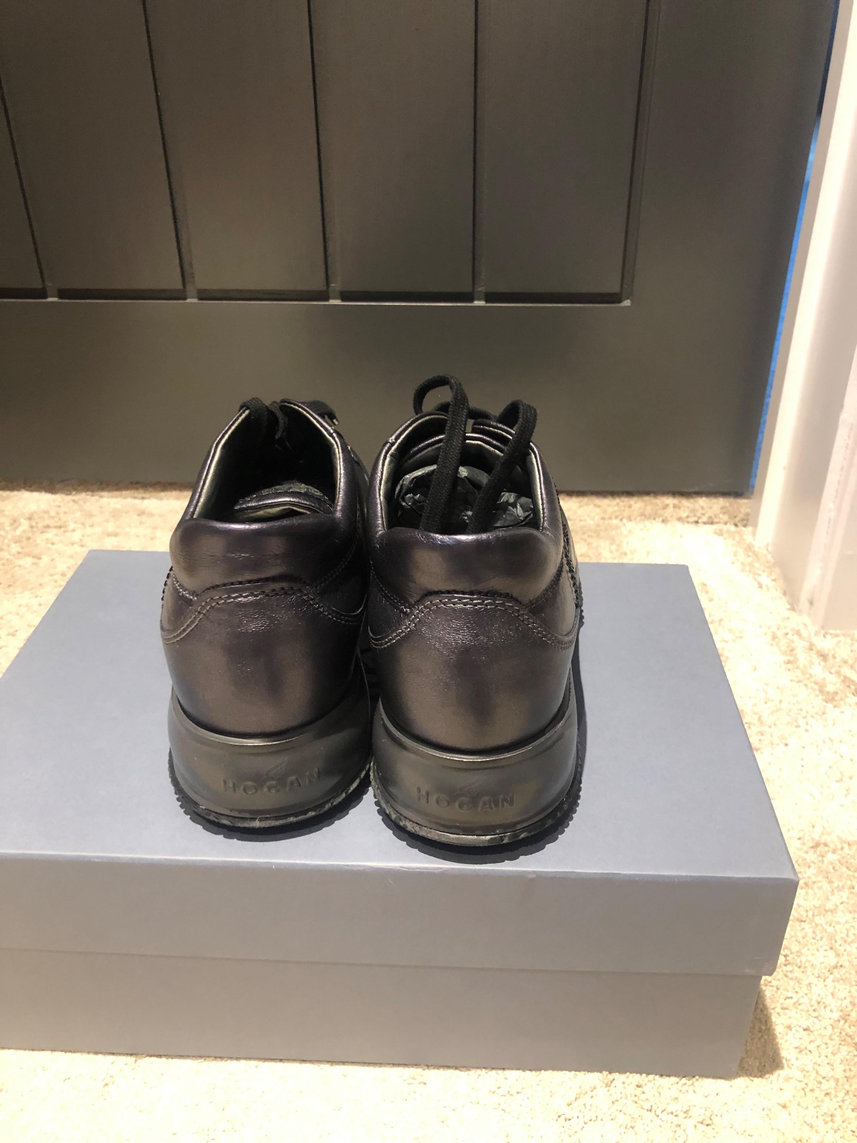 Black leather Interactive trainers