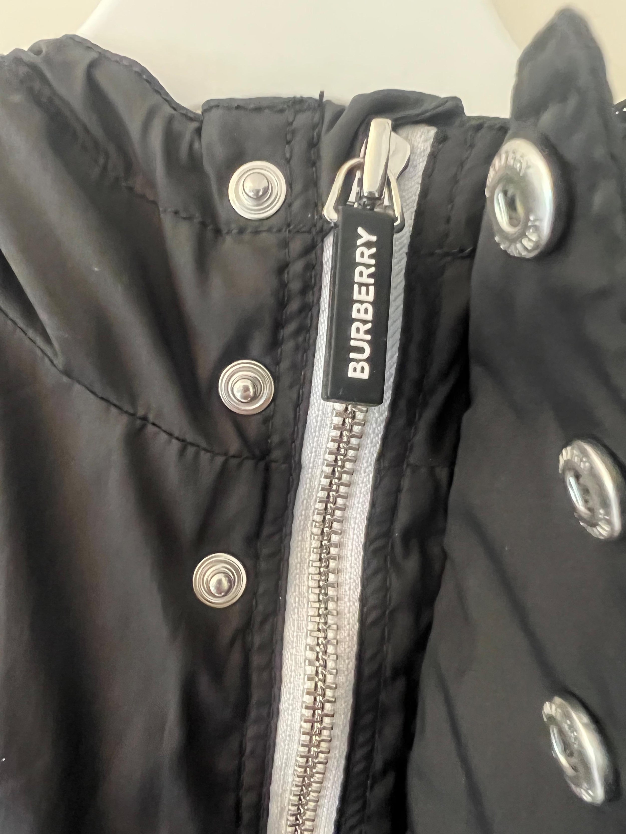 black logo raincoat
