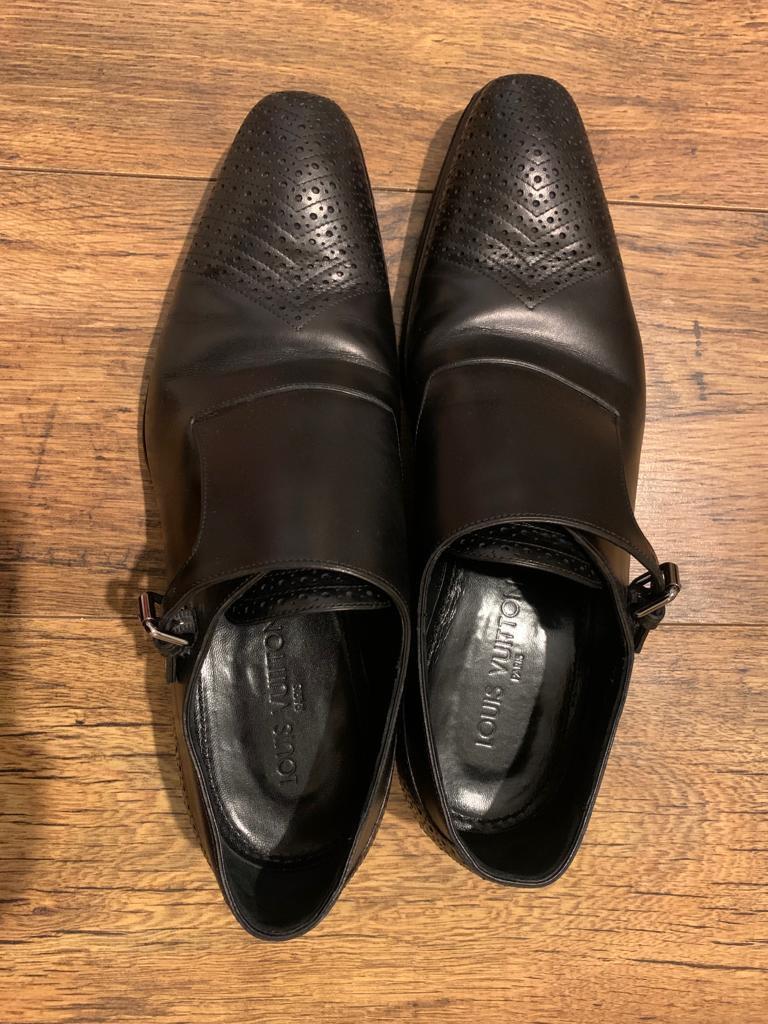Black perforated leather monk strap shoes