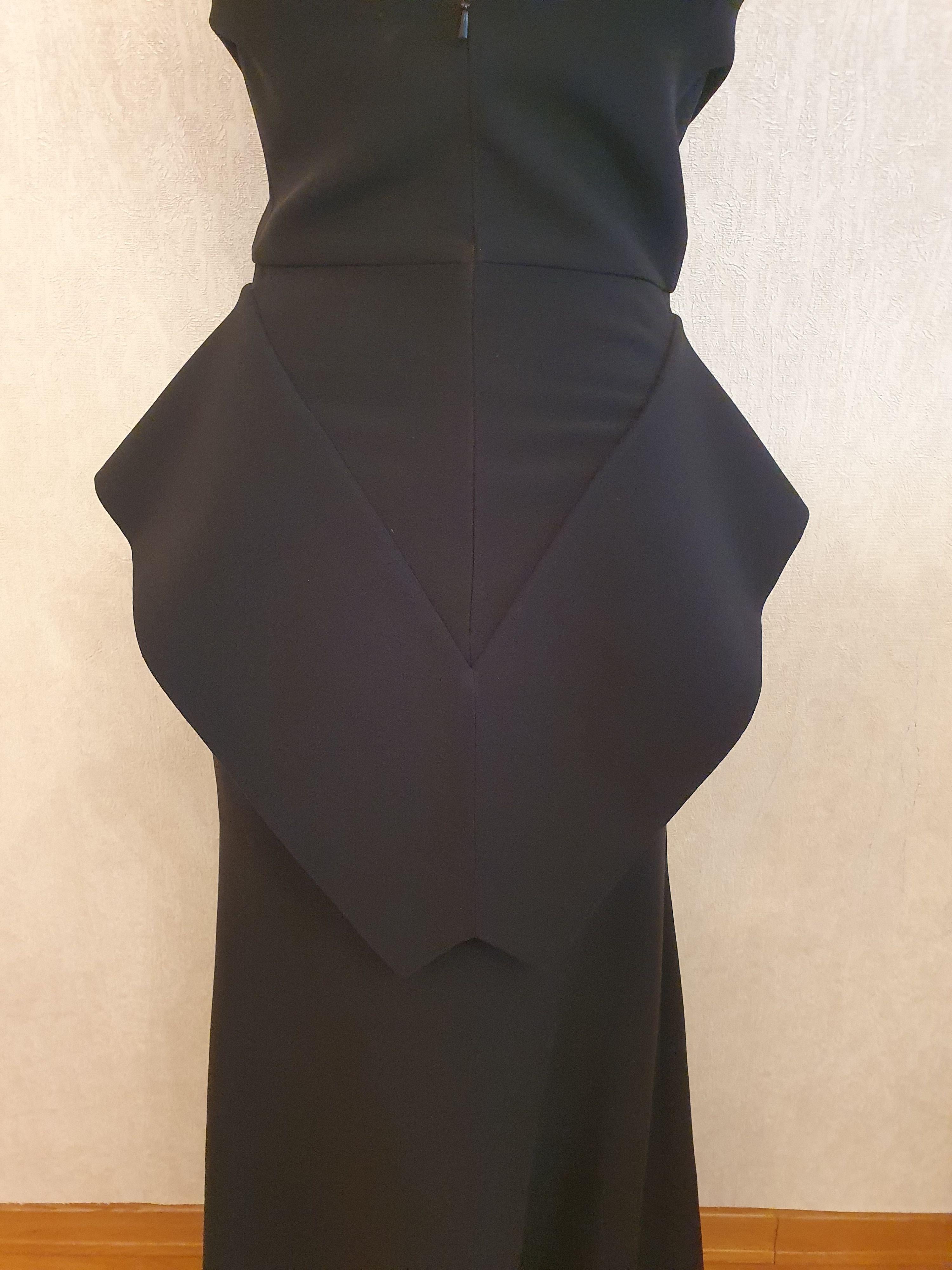 Black wool crepe one shoulder peplum gown