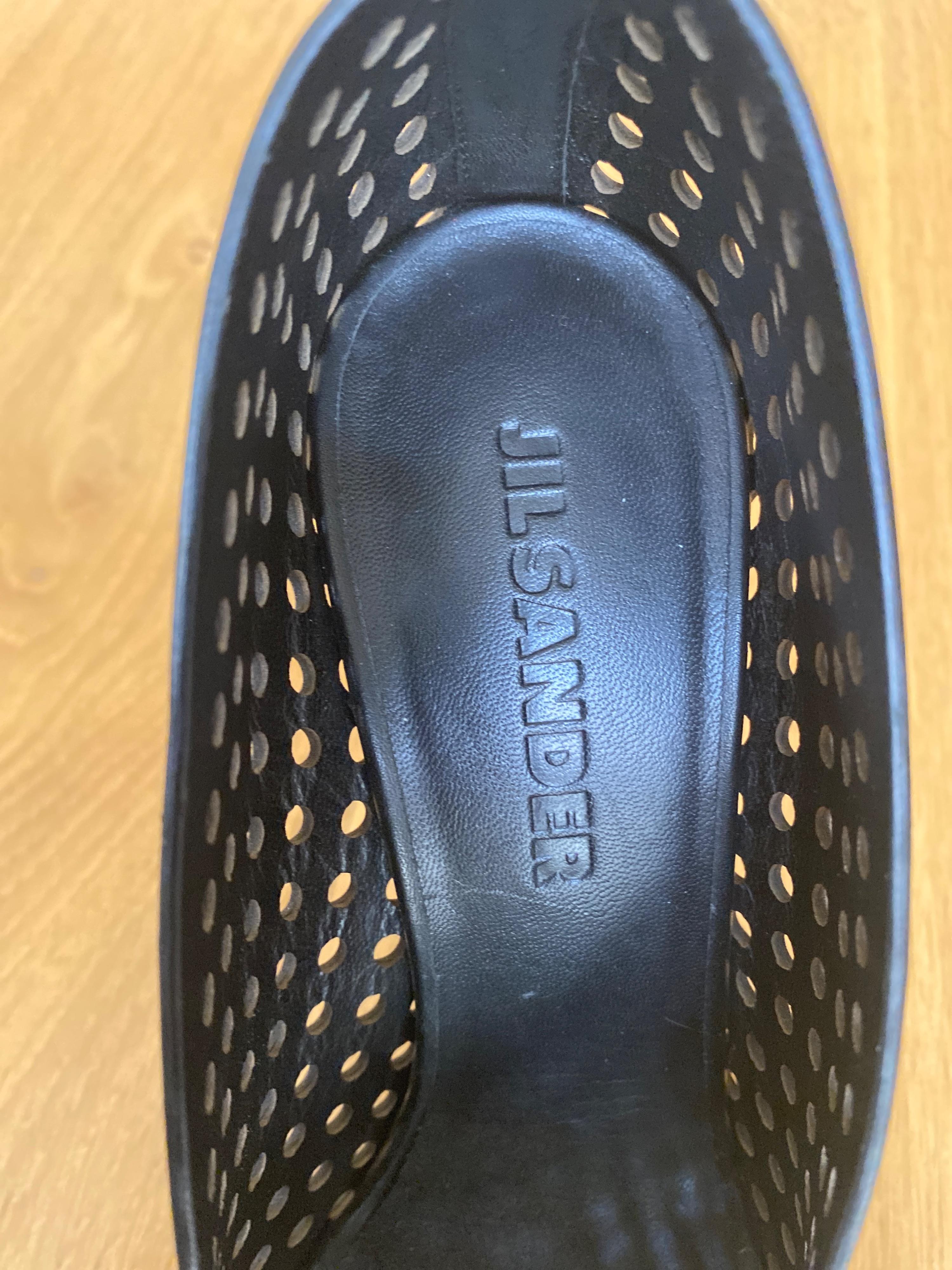 Black perforated leather platform heeled pumps