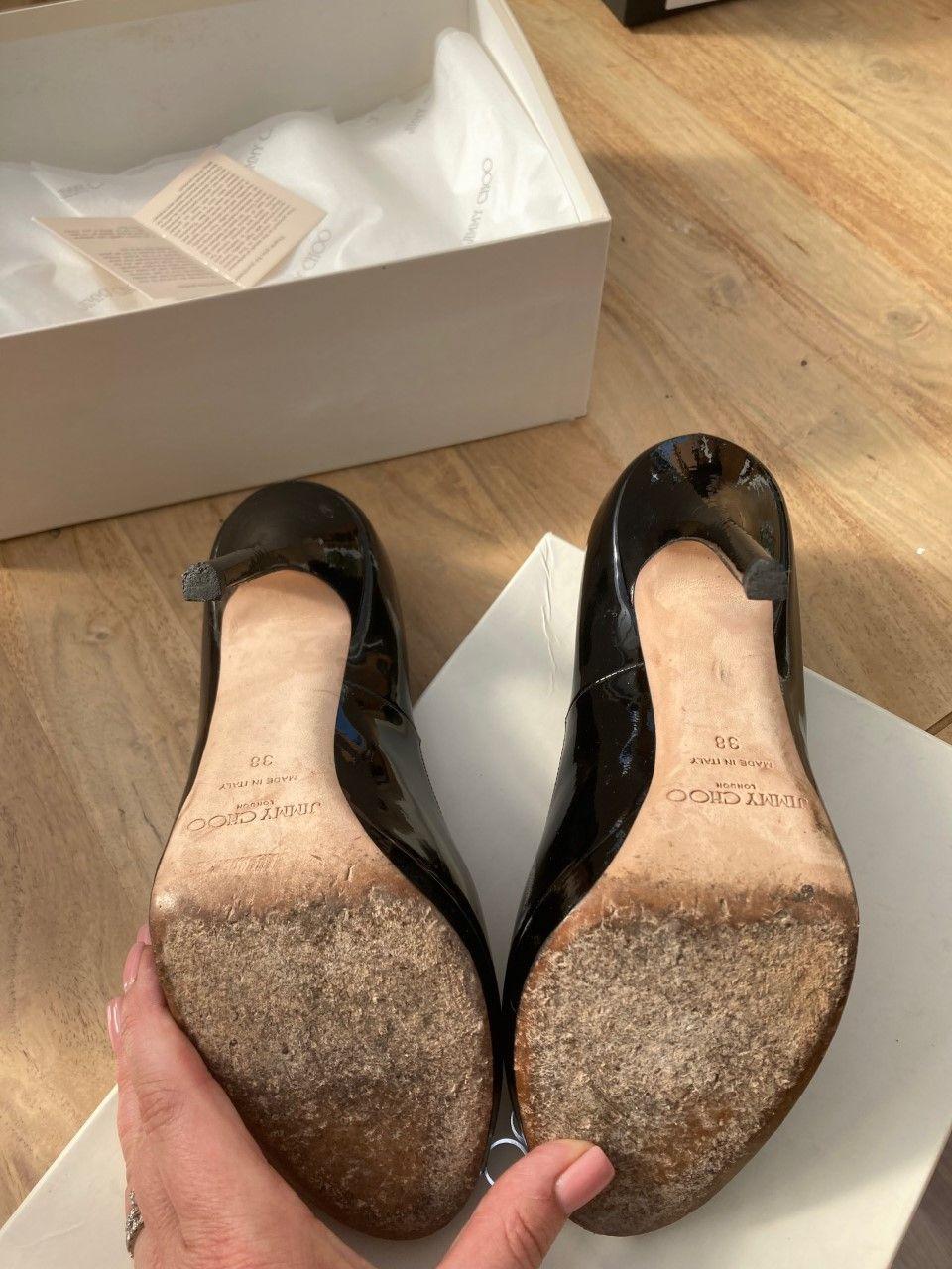Black patent peep-toe heeled pumps