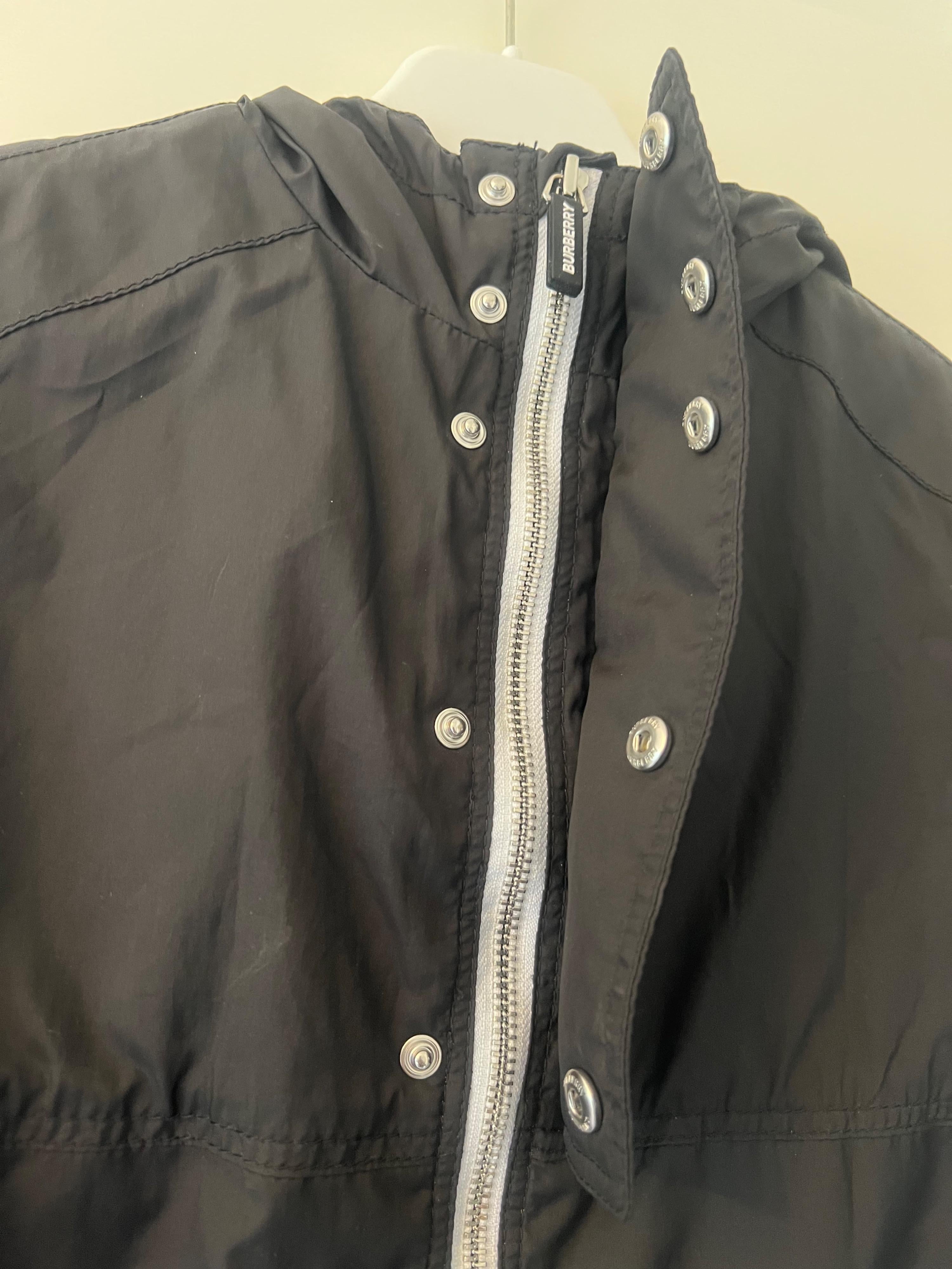 black logo raincoat