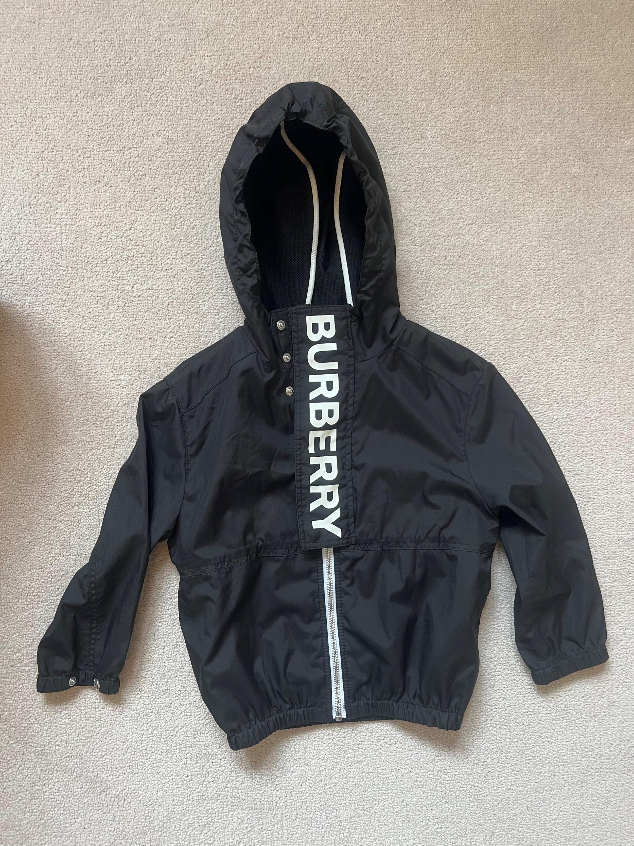 black logo raincoat