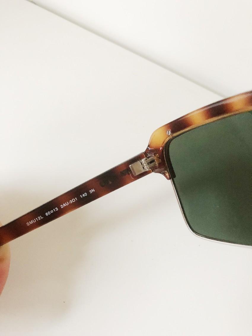 Miu Miu Tortoise Shell Sunglasses