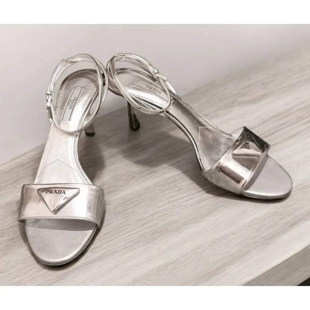 Prada Modellerie Logo-Plaque Metallic-Leather Sandals.