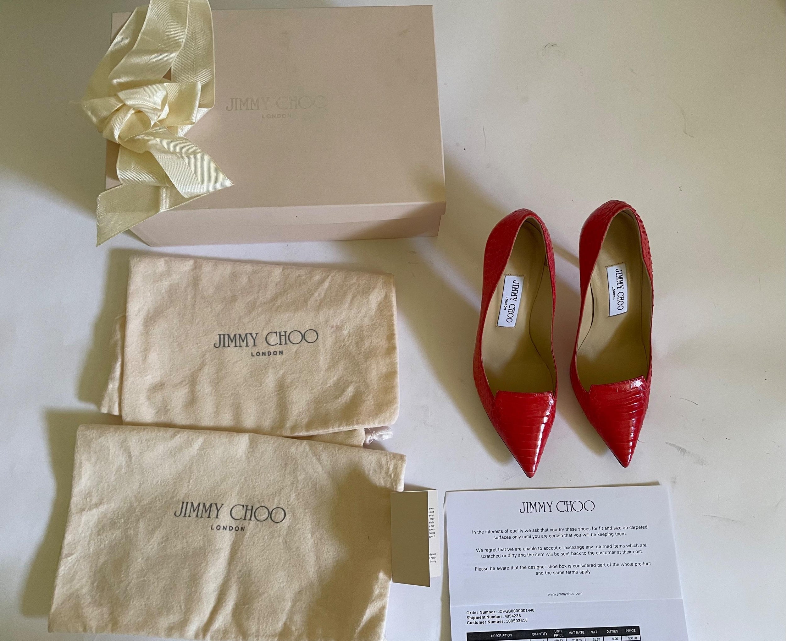 Red snakeskin Avril heeled pumps