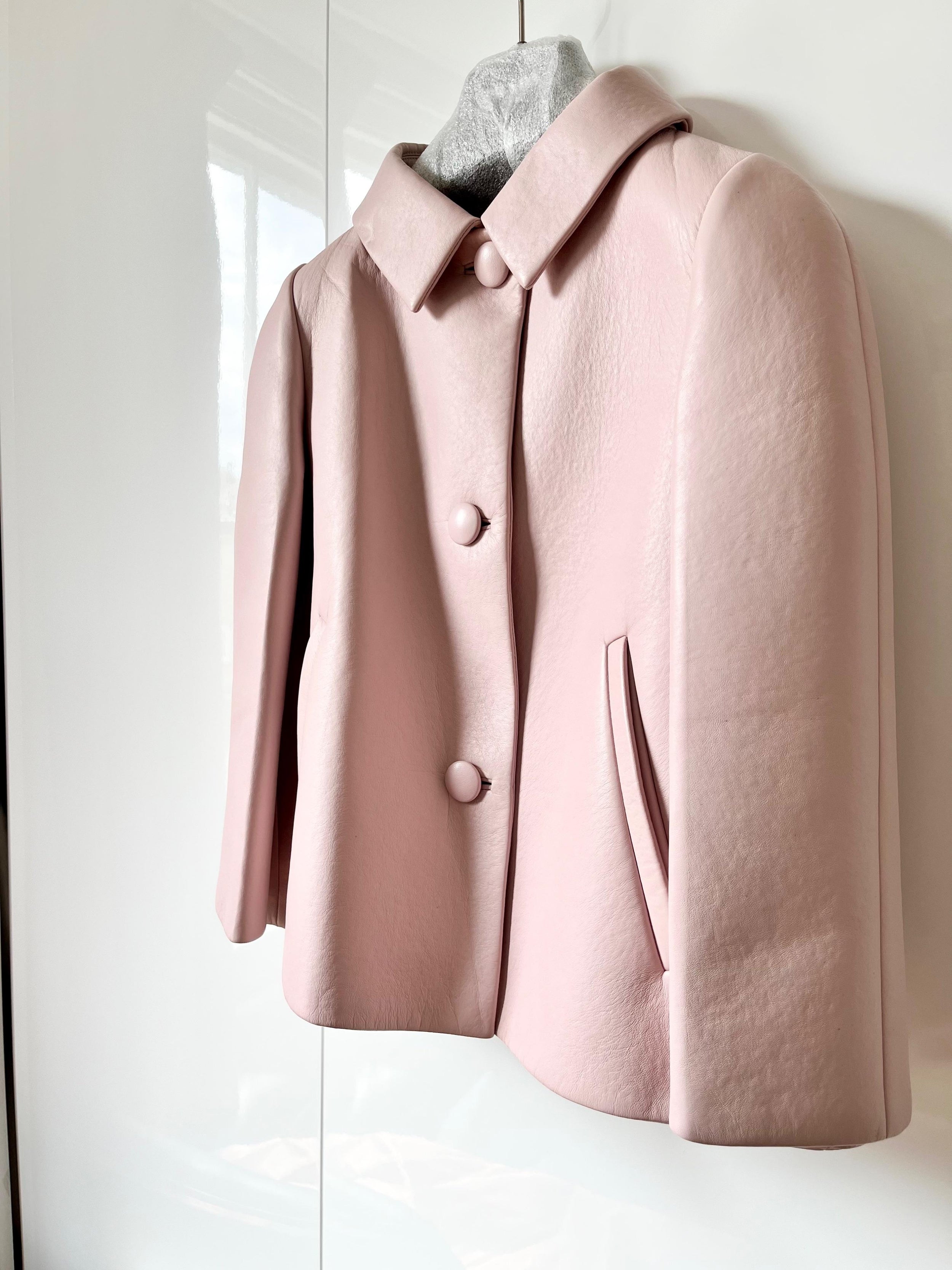 Pale pink cropped leather jacket