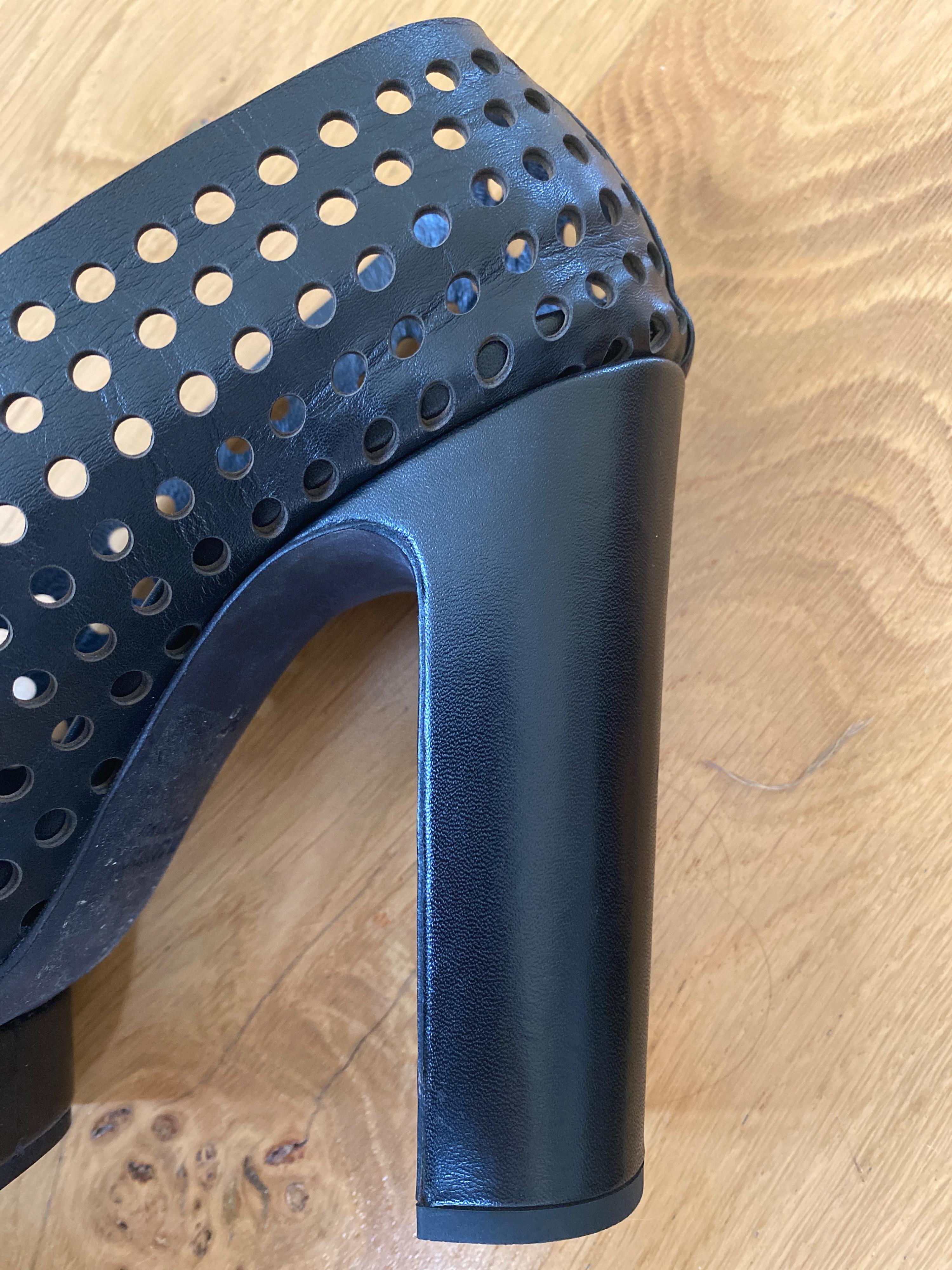 Black perforated leather platform heeled pumps