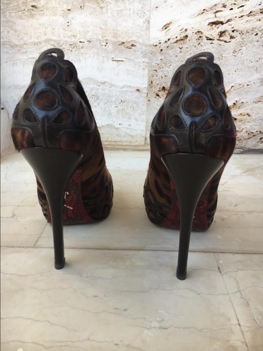 Cesare Paciotti animal print pony hair stiletto pumps