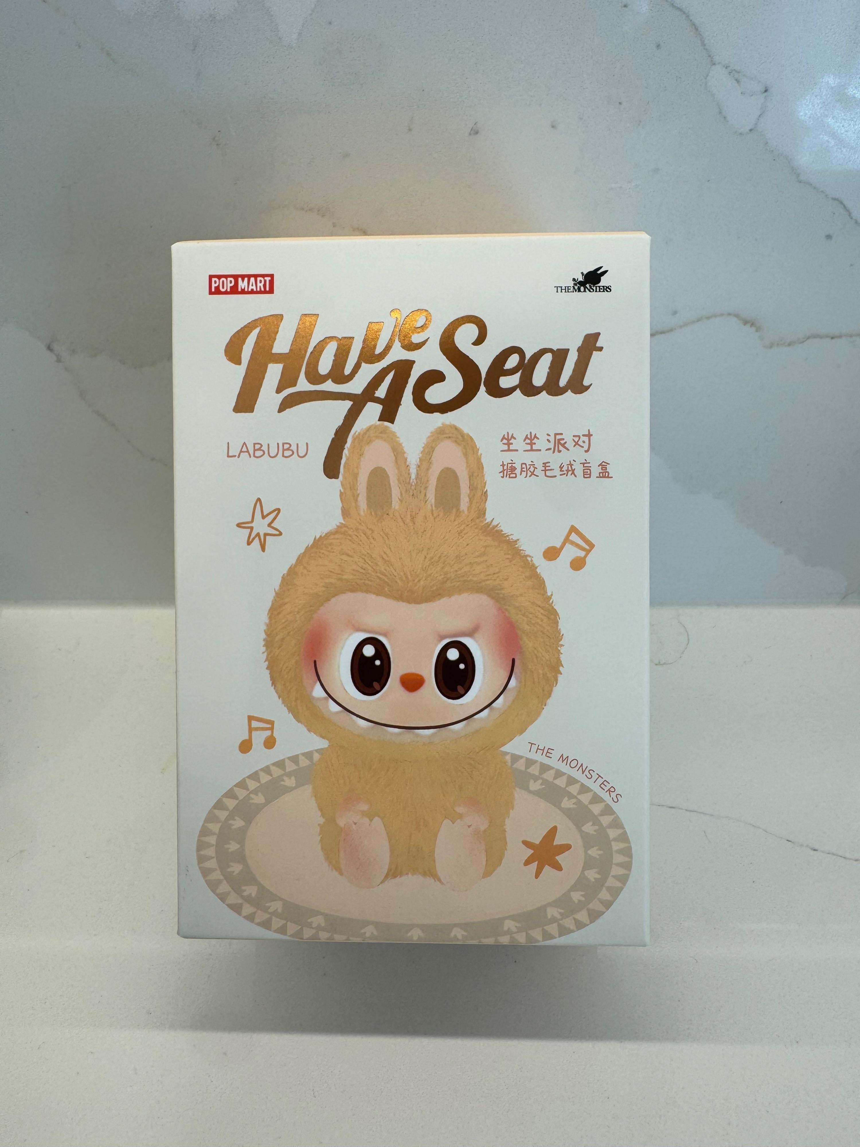 DUO DUO "Have a Seat" Labubu bag charm.