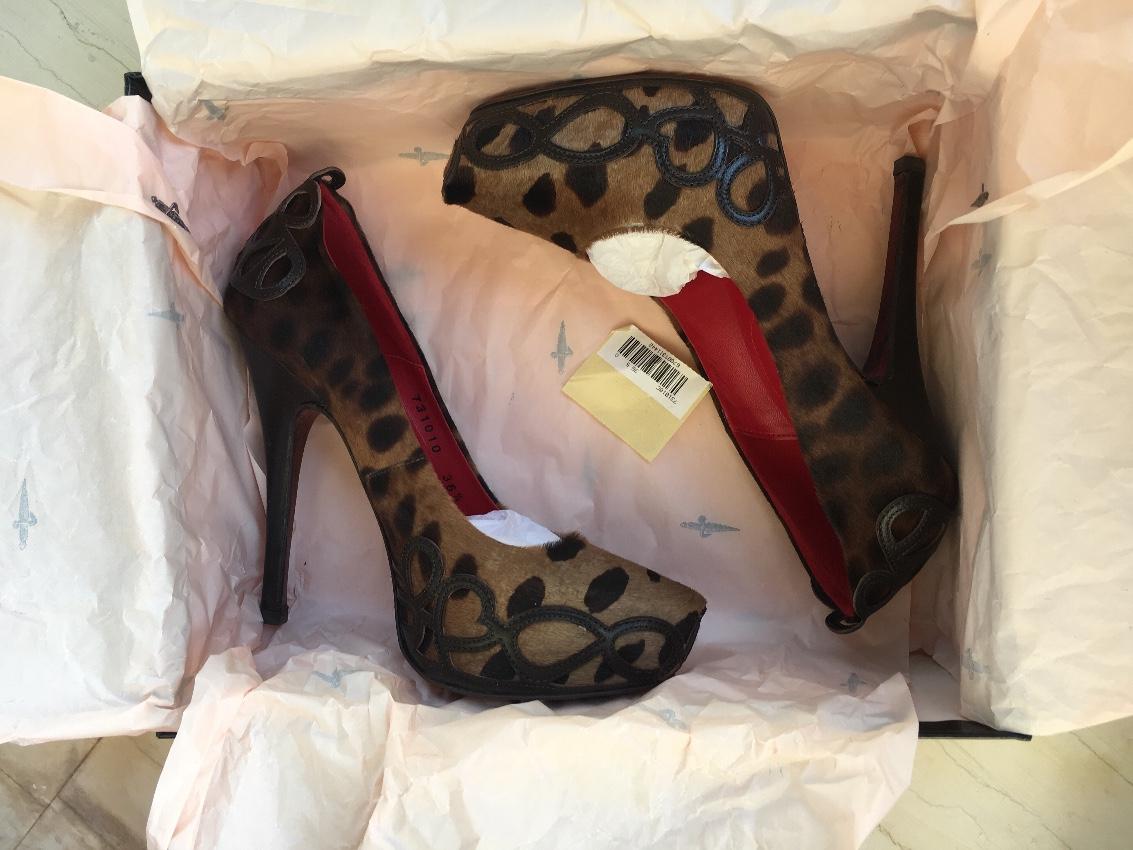 Cesare Paciotti animal print pony hair stiletto pumps