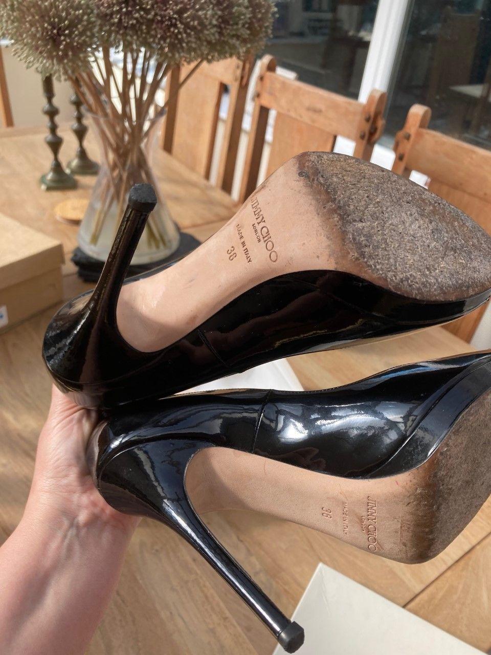 Black patent peep-toe heeled pumps