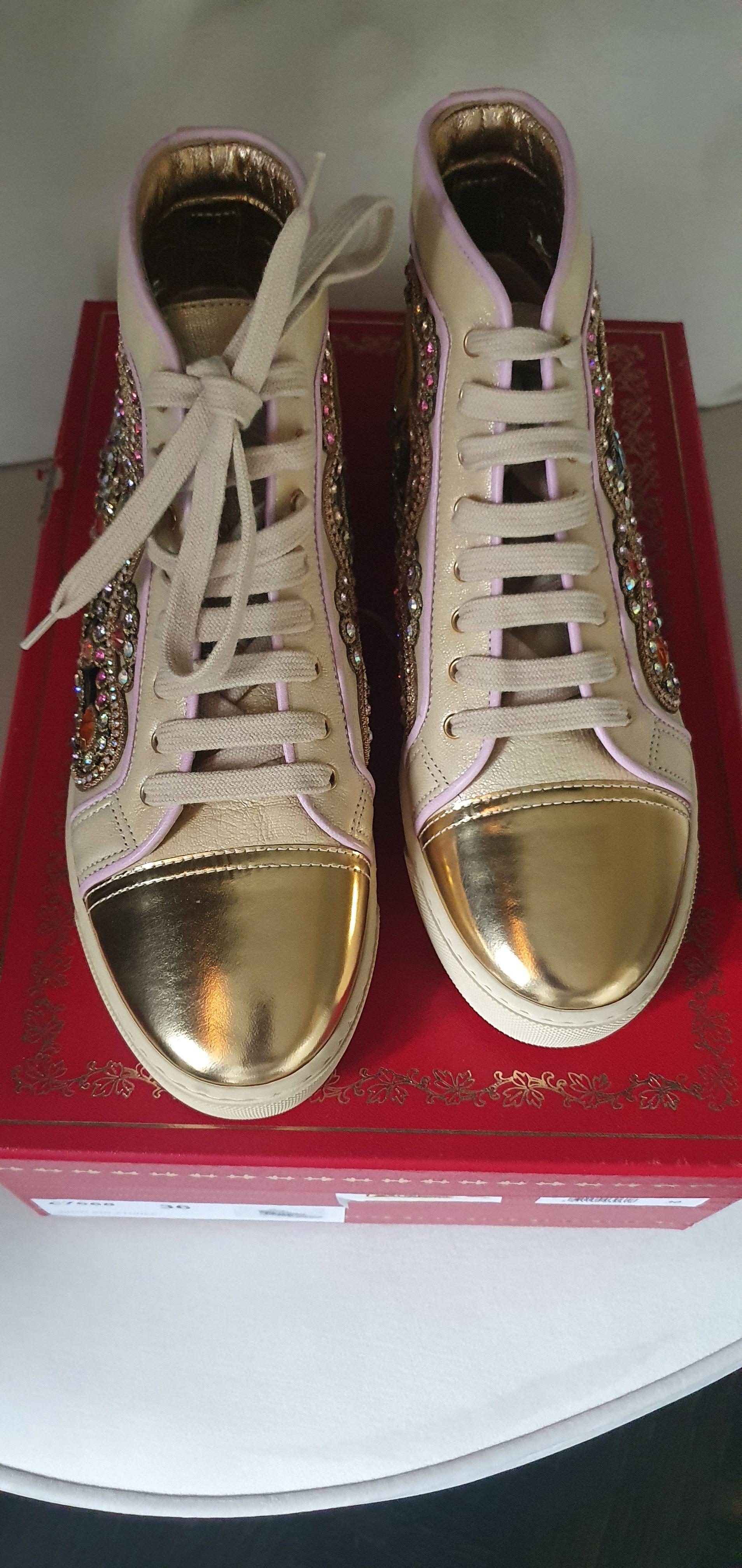 Metallic gold leather & crystal cut-out trainers