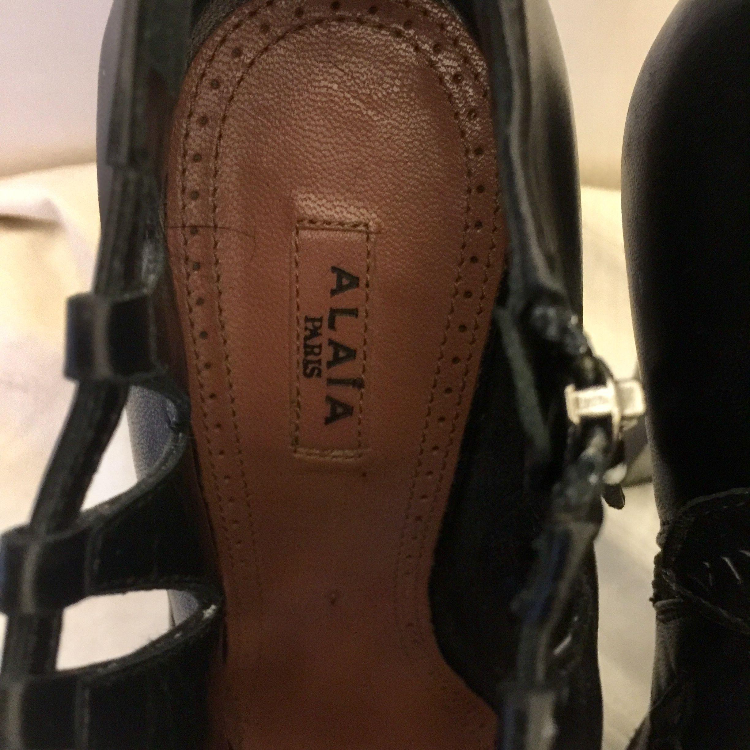 Black leather cut-out platform heeled booties