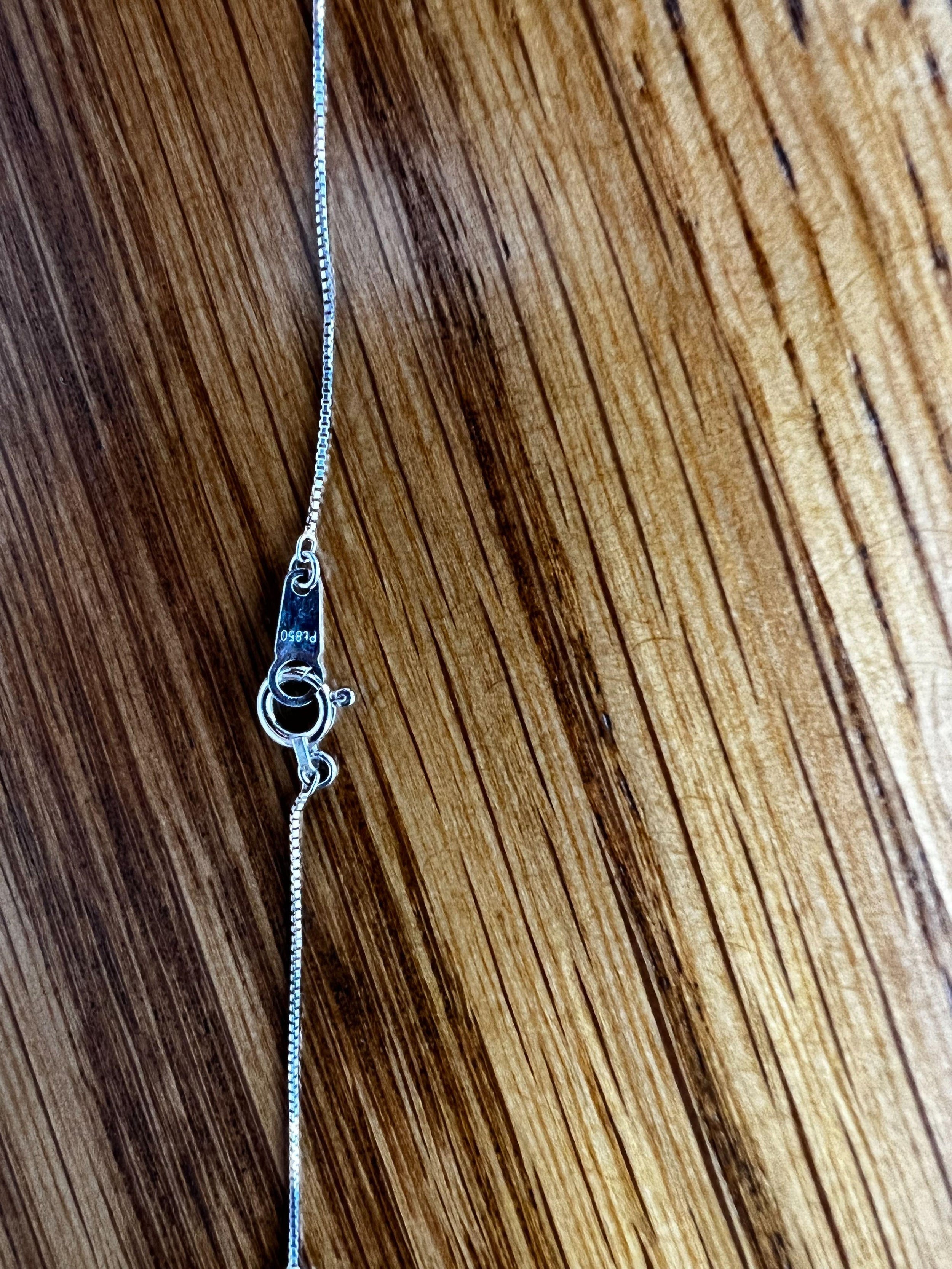 Platinum, emerald & diamond pendant necklace