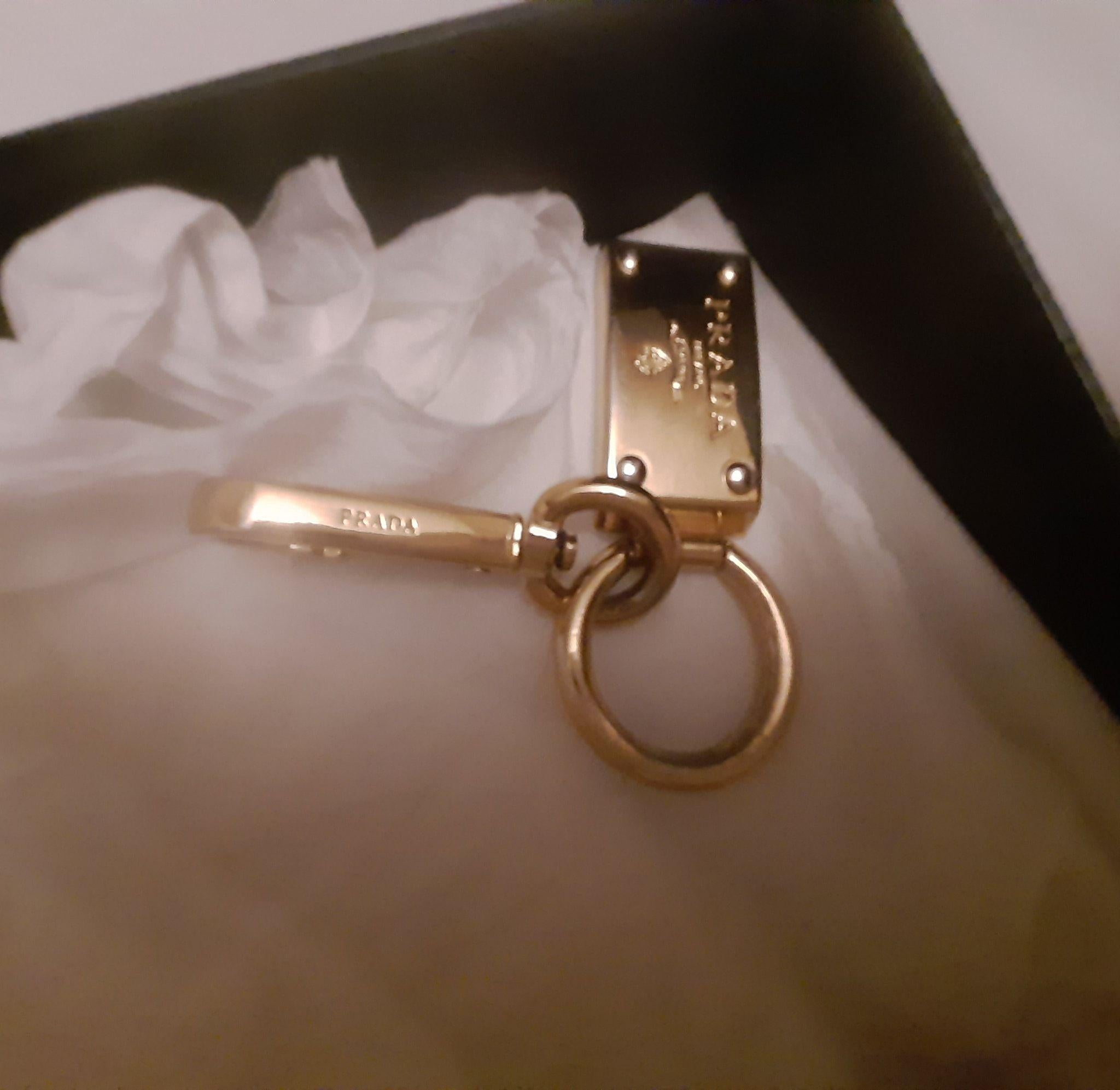 Gold-tone metal logo charm keyring