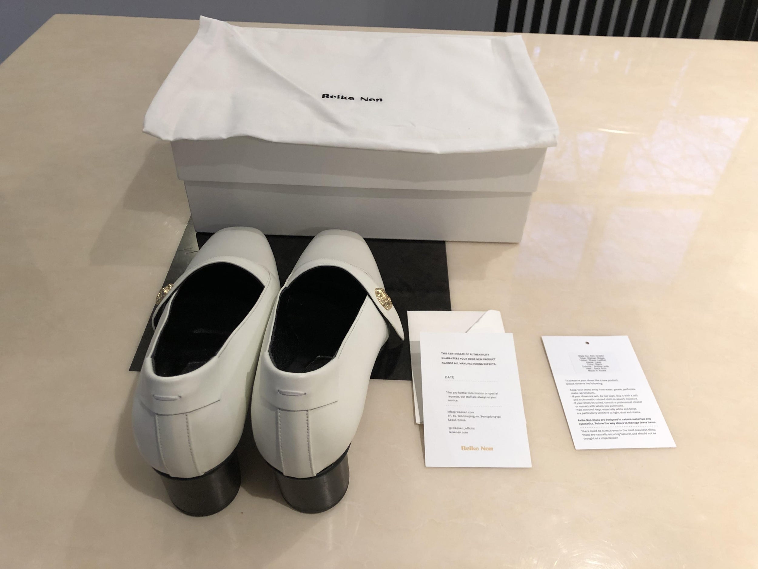 Reike Nen white leather pumps