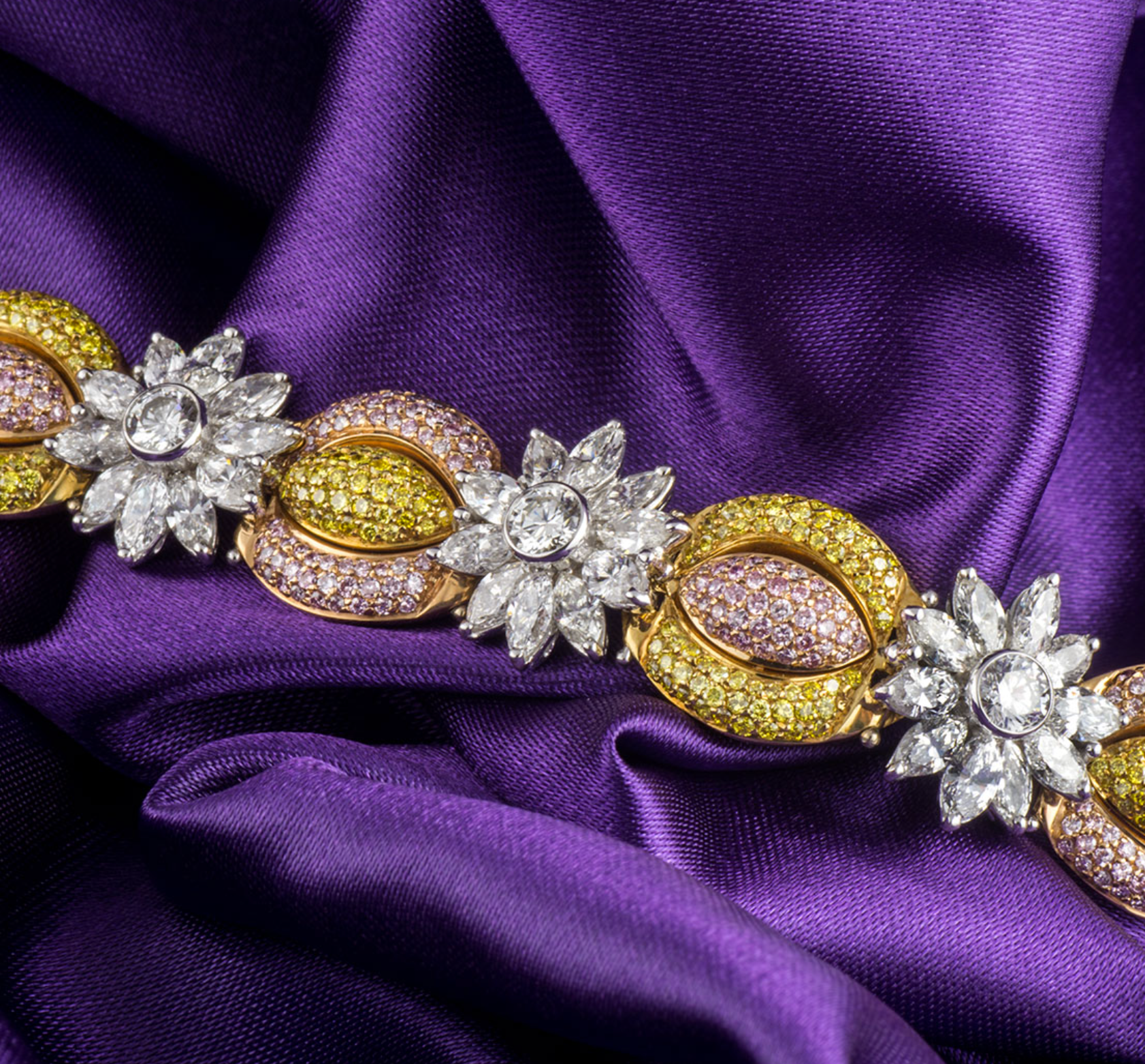 18ct white gold, white, yellow & pink fancy diamond bracelet