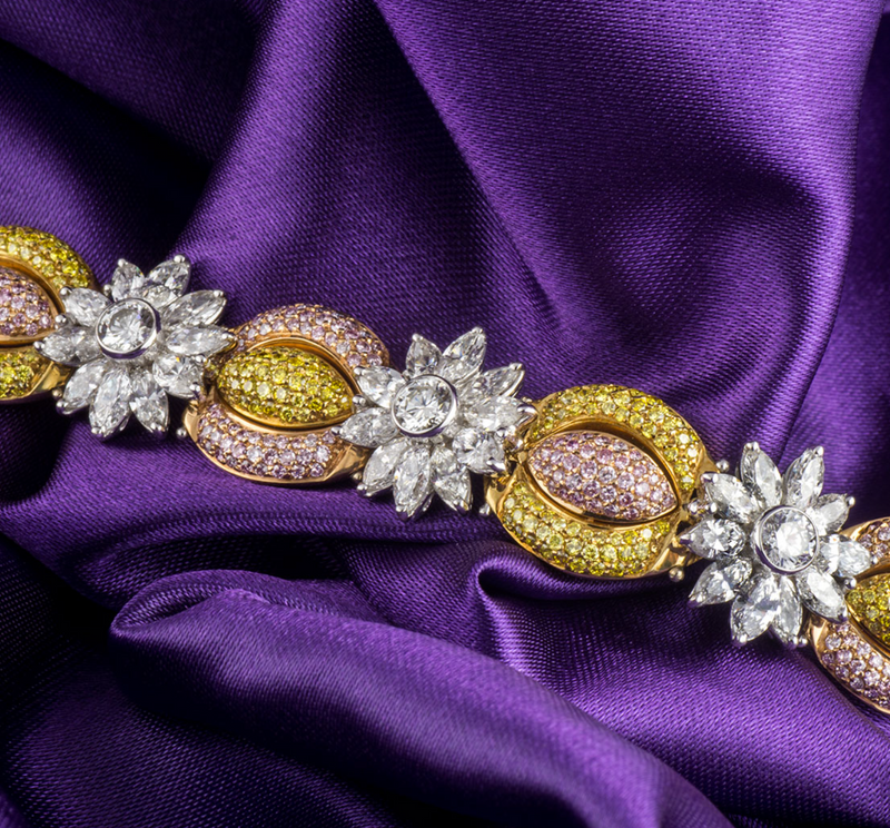 18ct white gold, white, yellow & pink fancy diamond bracelet