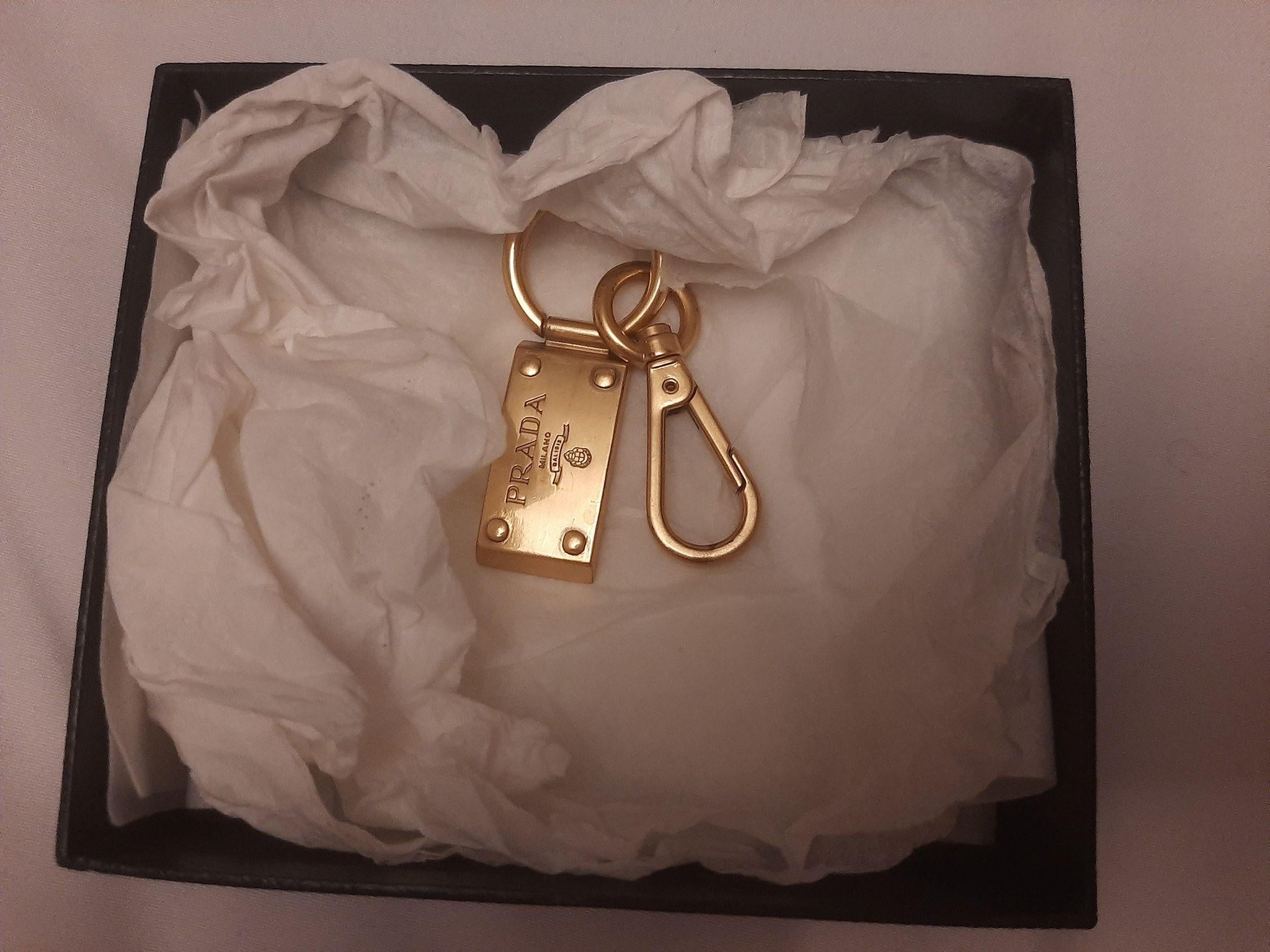 Gold-tone metal logo charm keyring