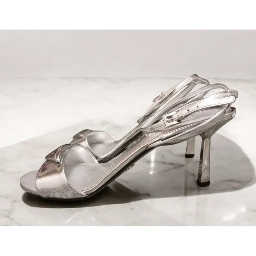 Prada Modellerie Logo-Plaque Metallic-Leather Sandals.