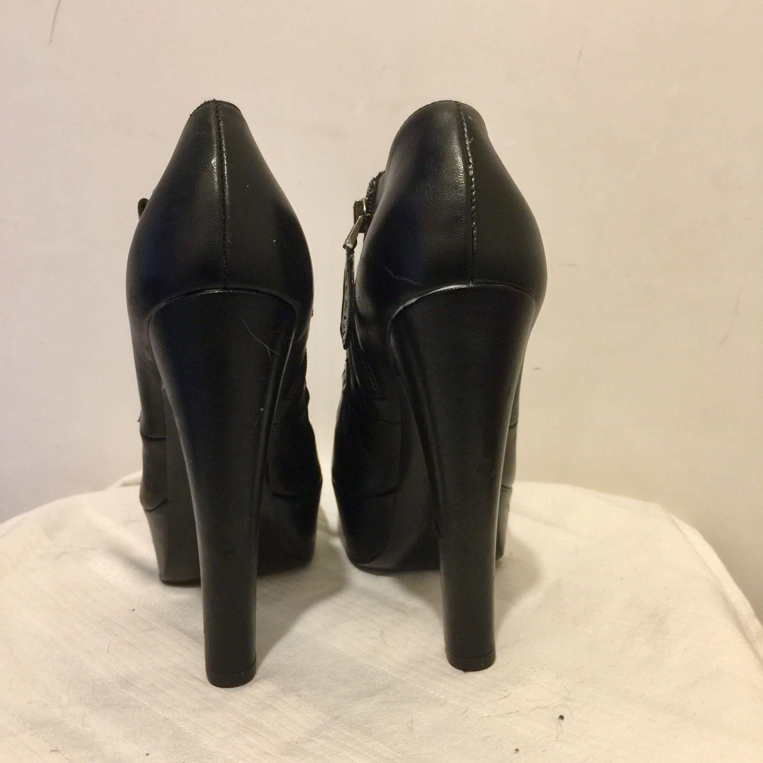 Black leather cut-out platform heeled booties