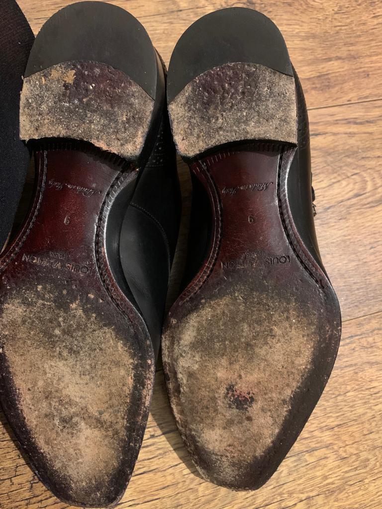 Black perforated leather monk strap shoes
