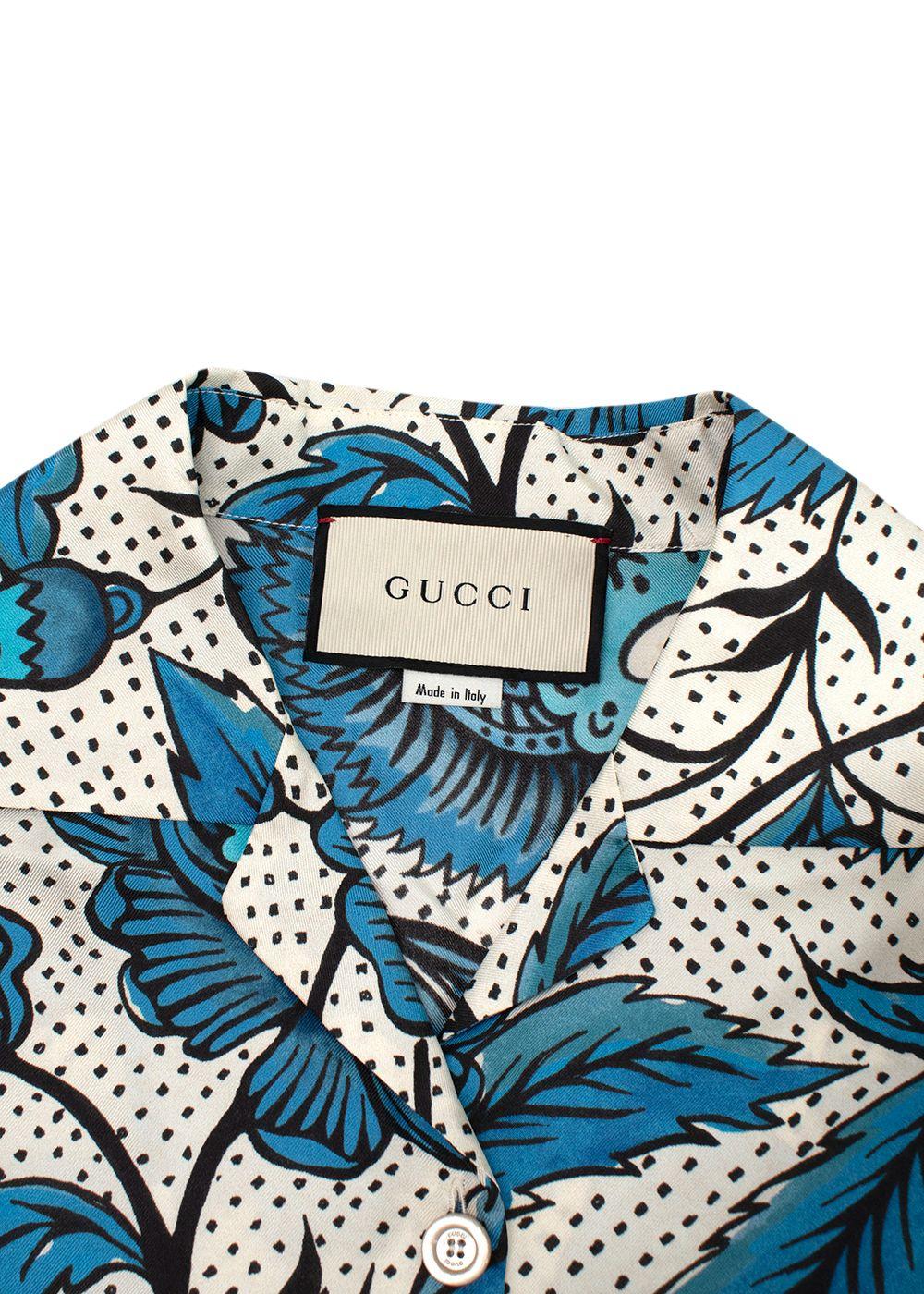 blue/white short sleeve shirt with floral print