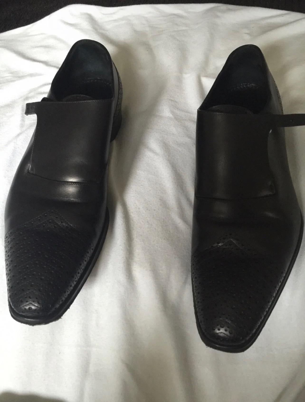 Black perforated leather monk strap shoes