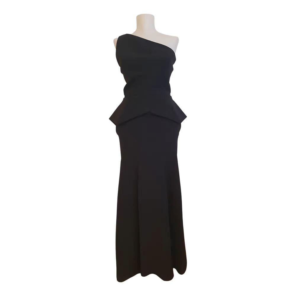 Black wool crepe one shoulder peplum gown