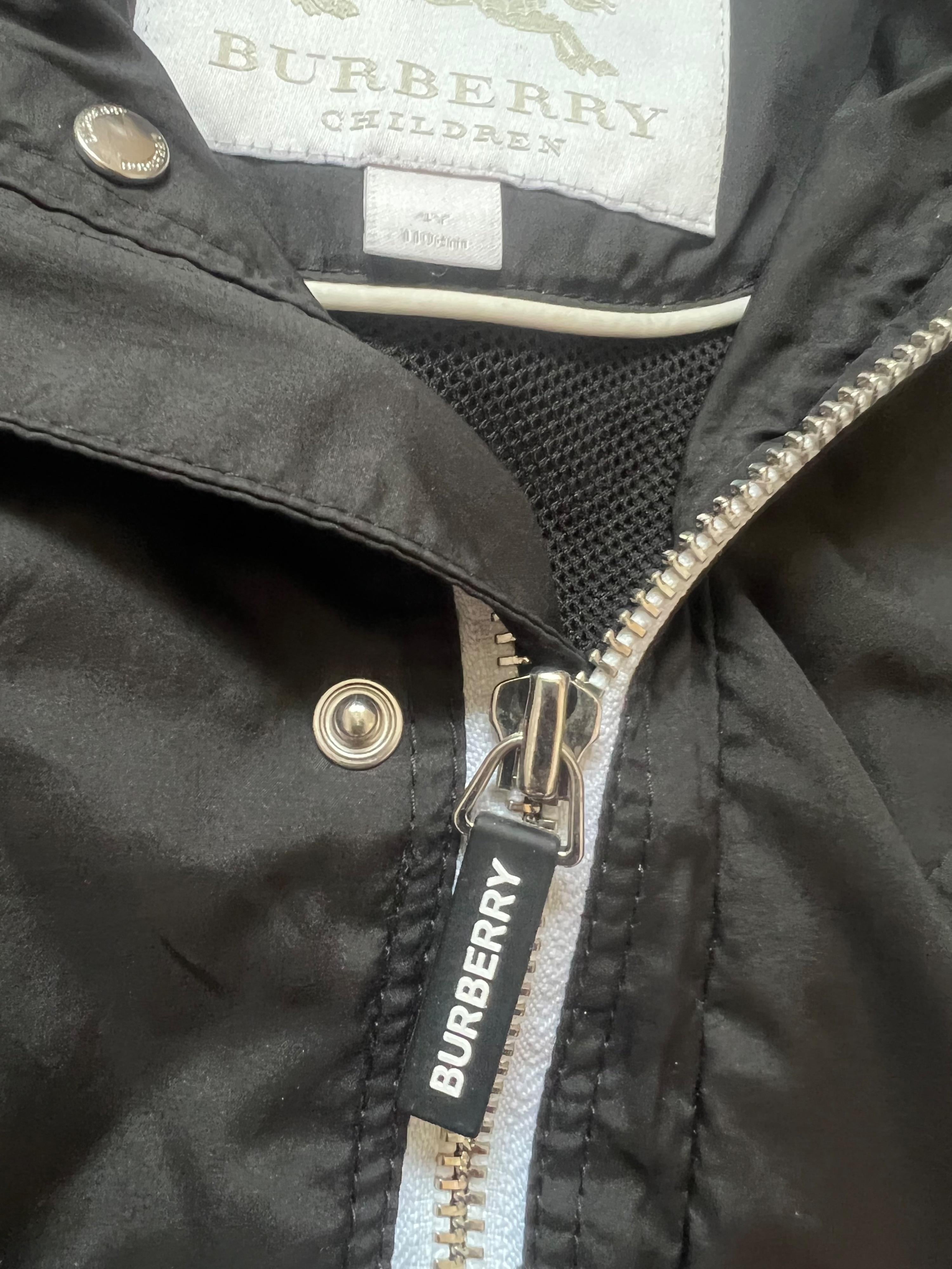 black logo raincoat