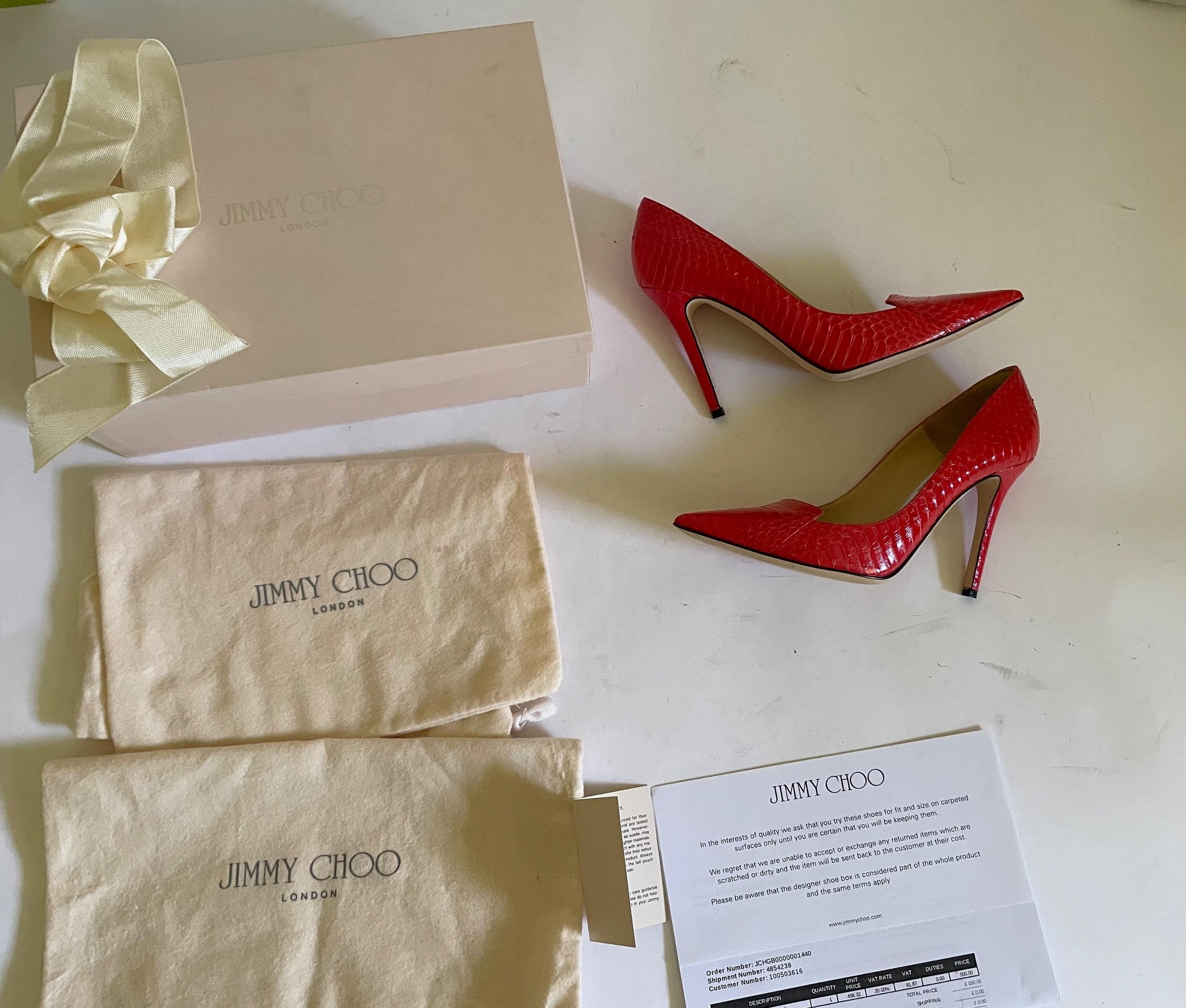 Red snakeskin Avril heeled pumps