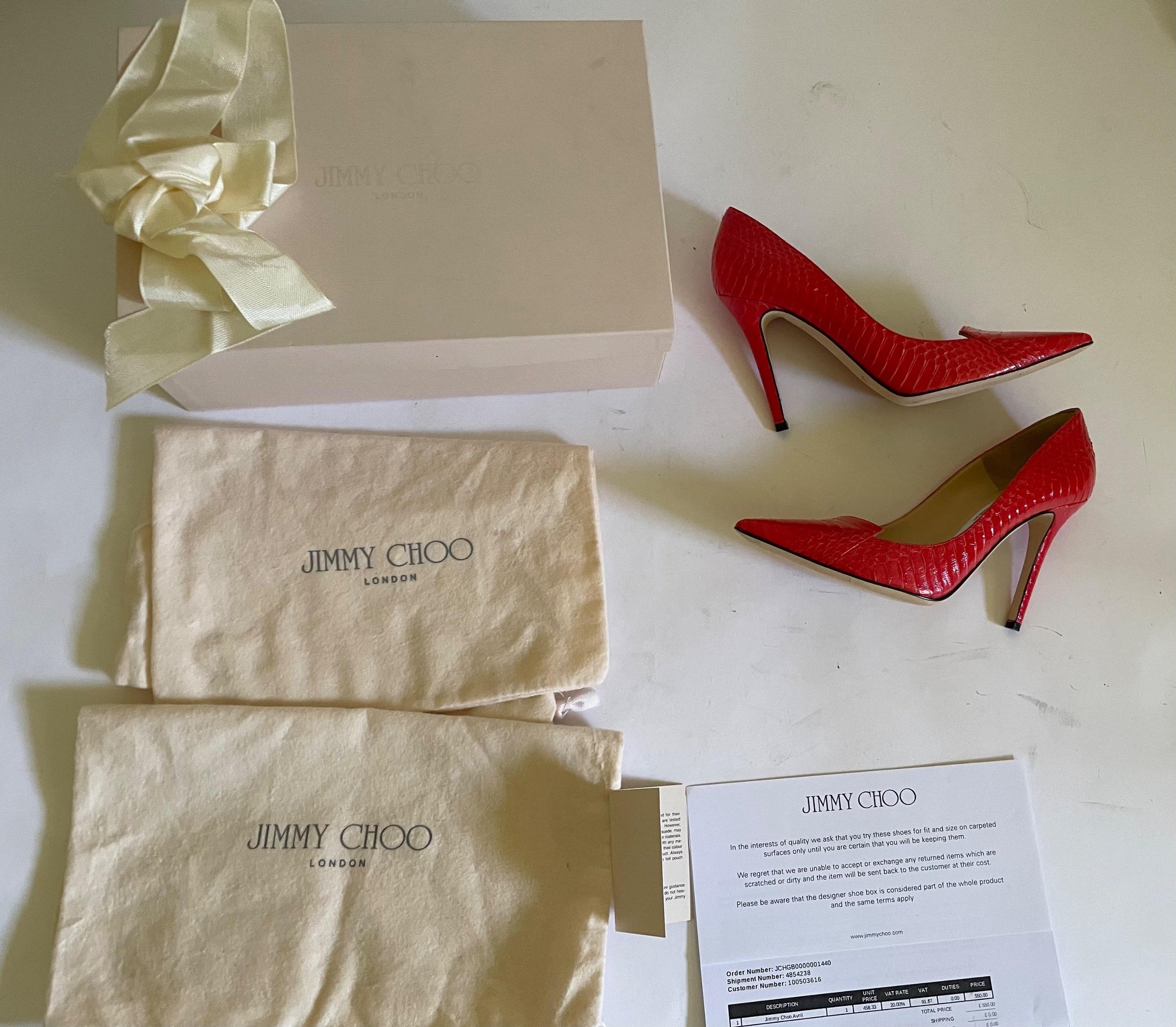 Red snakeskin Avril heeled pumps