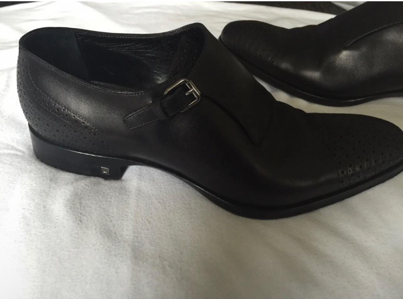 Black perforated leather monk strap shoes
