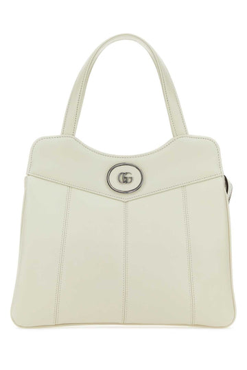 Gucci Leather Gg Medallion Top Handle Bag — Beige