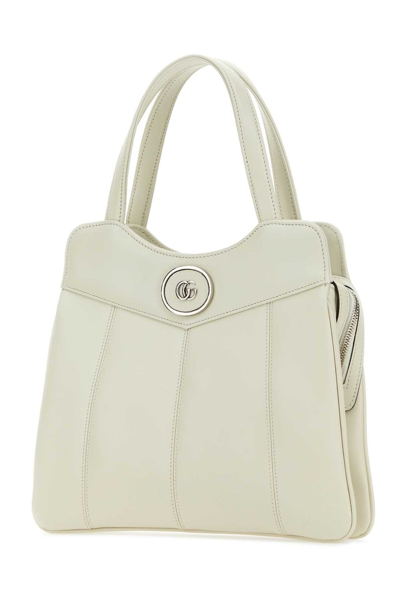 Gucci Leather Gg Medallion Top Handle Bag — Beige